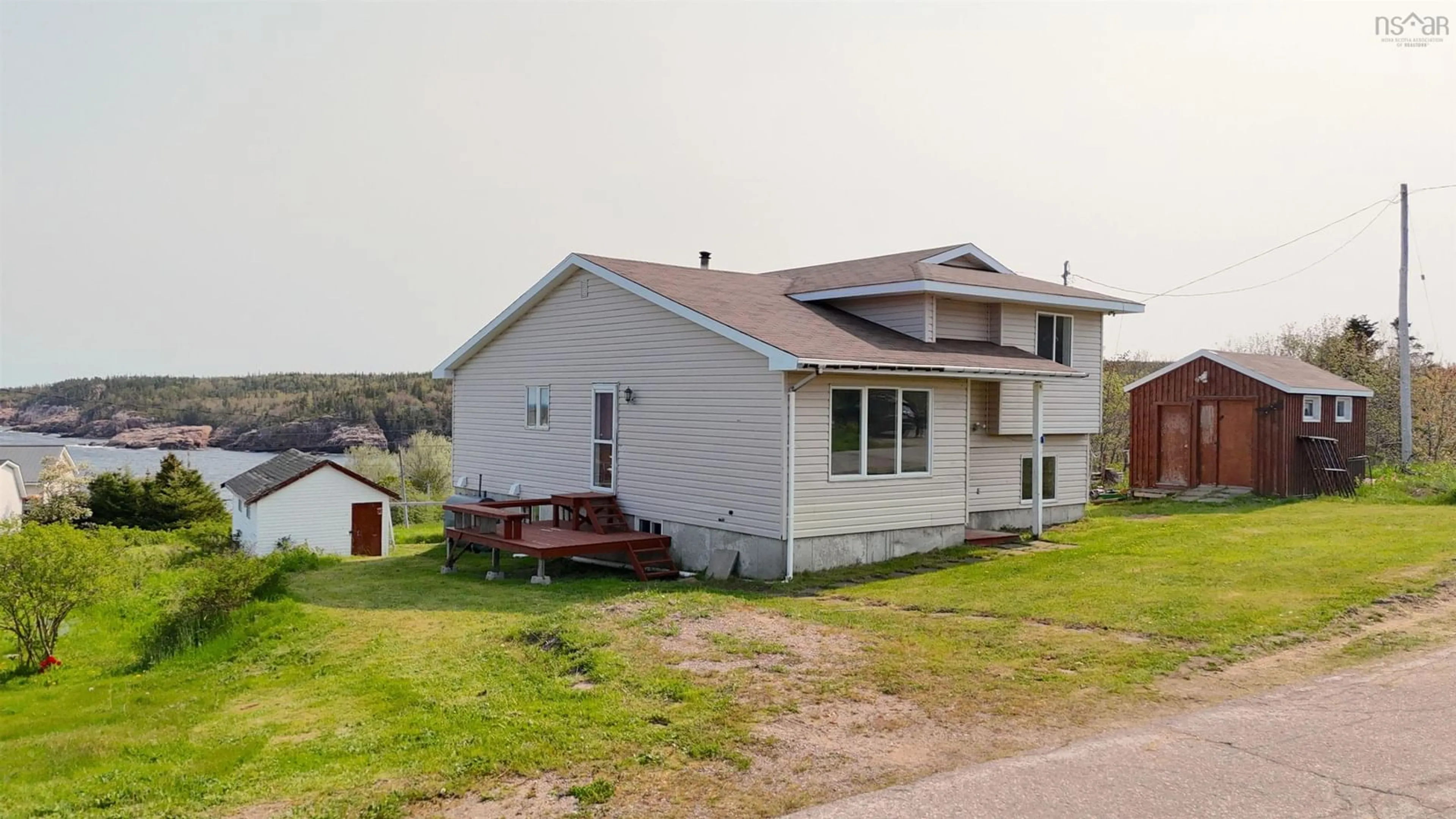 A pic from outside/outdoor area/front of a property/back of a property/a pic from drone, building for 17 Cyrils Dr, Neils Harbour Nova Scotia B0C 1N0