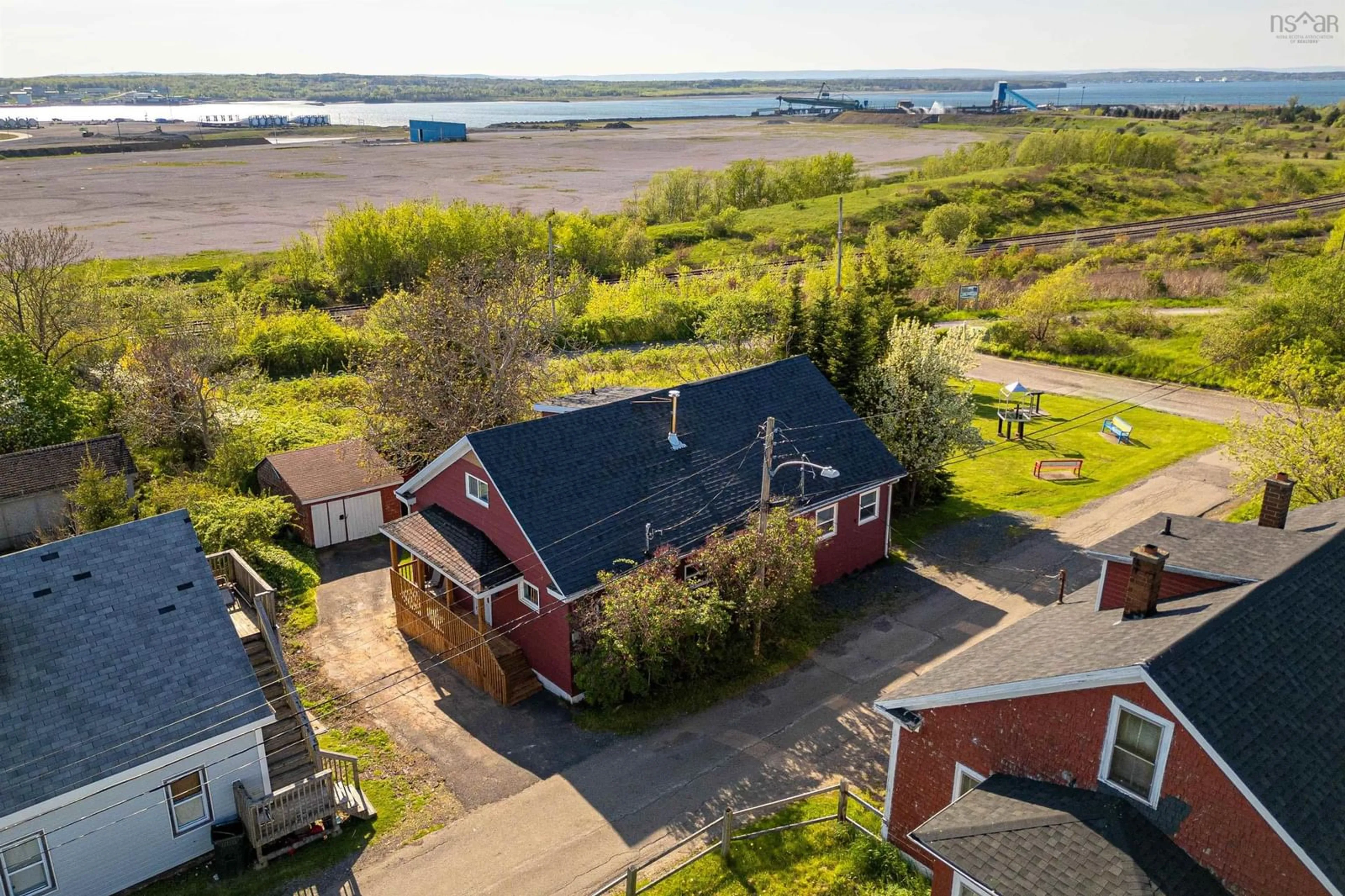 A pic from outside/outdoor area/front of a property/back of a property/a pic from drone, water/lake/river/ocean view for 15-17 Ferris St, Whitney Pier Nova Scotia B1N 2M9