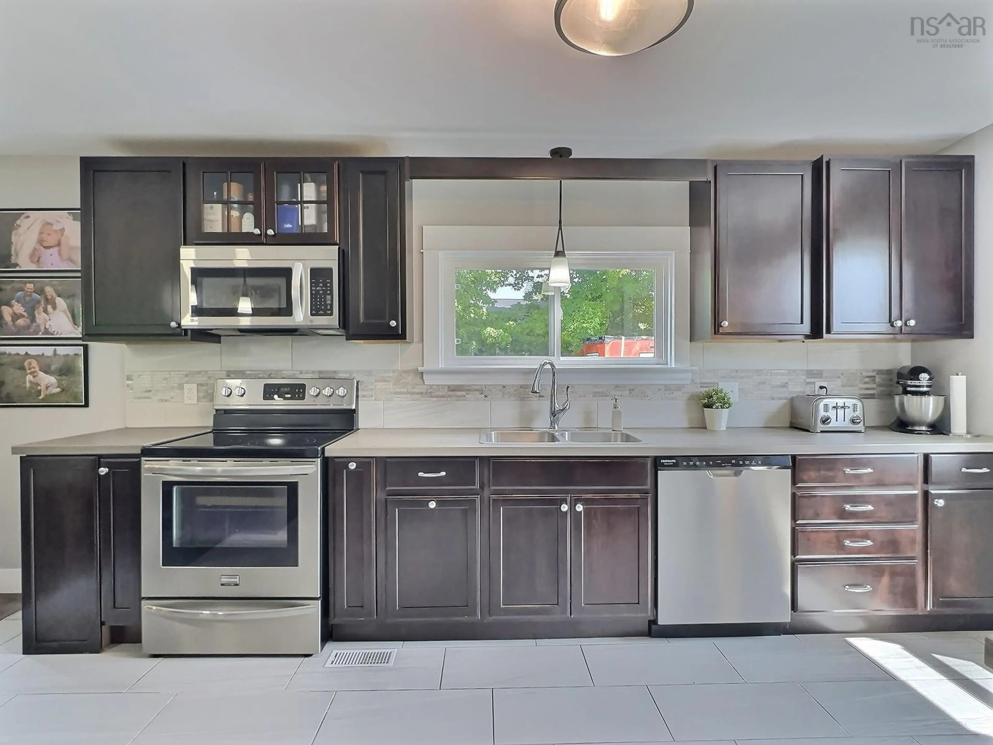 Contemporary kitchen, ceramic/tile floor for 1395 East Prince St, Salmon River Nova Scotia B2N 7G3