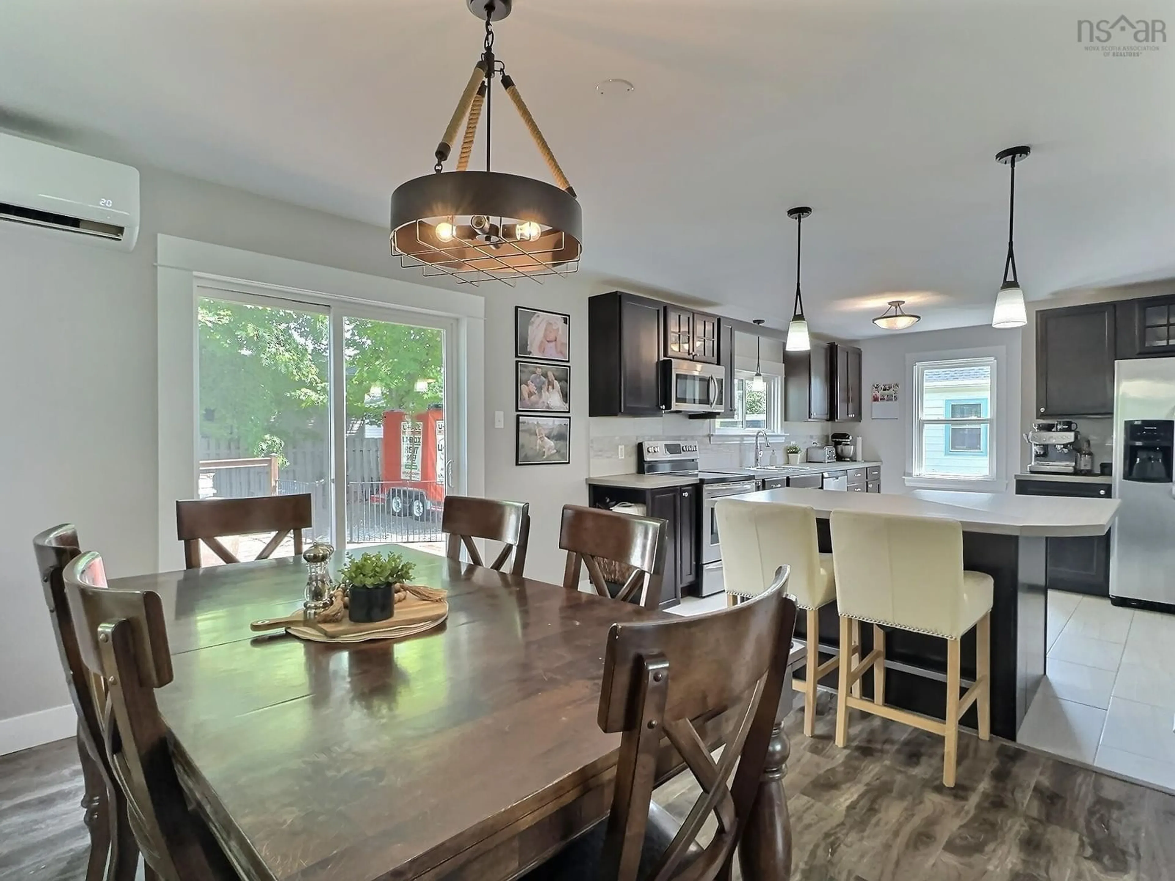 Open concept kitchen, wood/laminate floor for 1395 East Prince St, Salmon River Nova Scotia B2N 7G3