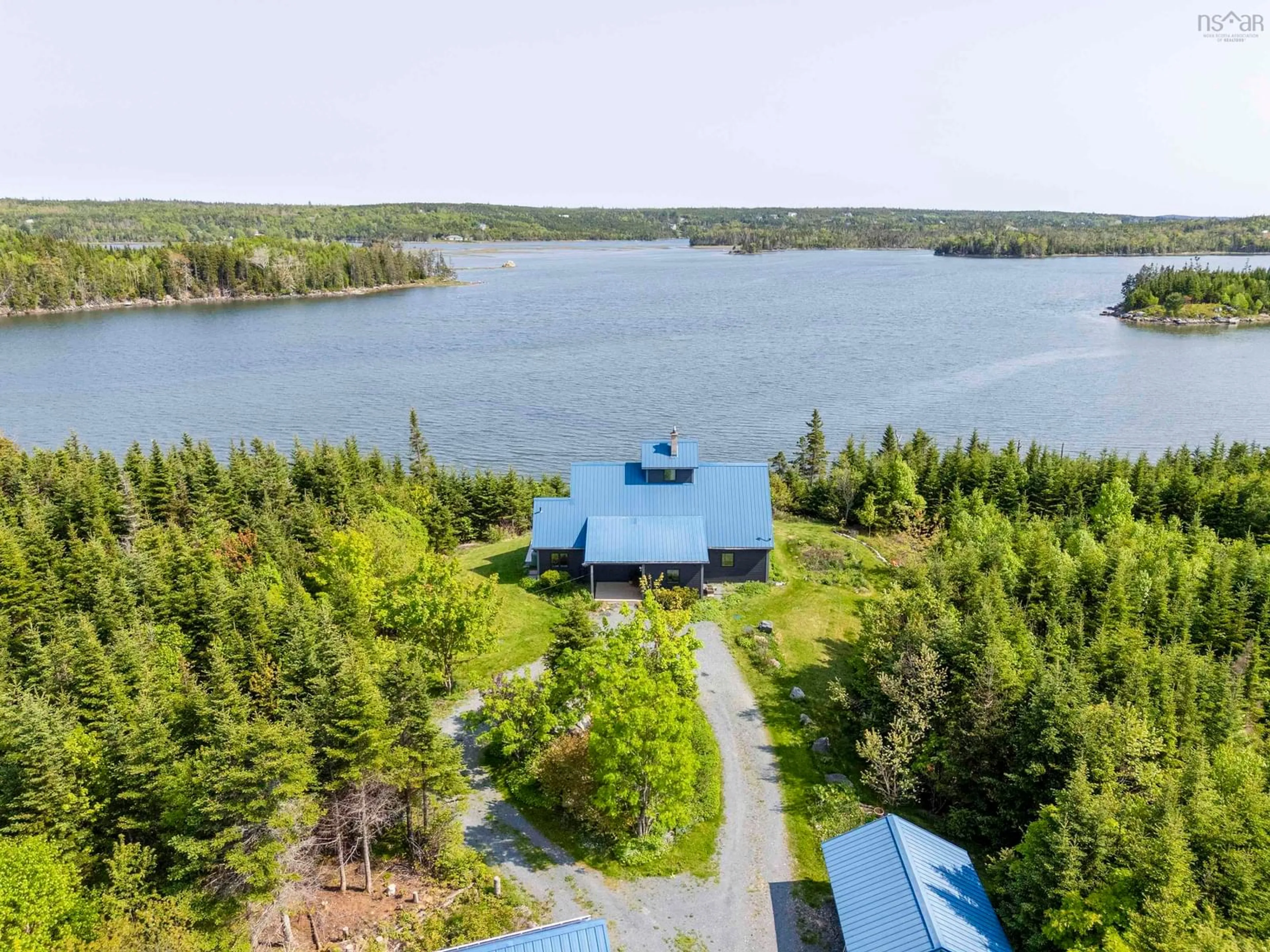 A pic from outside/outdoor area/front of a property/back of a property/a pic from drone, water/lake/river/ocean view for 899 West Petpeswick Rd, West Petpeswick Nova Scotia B0J 2L0