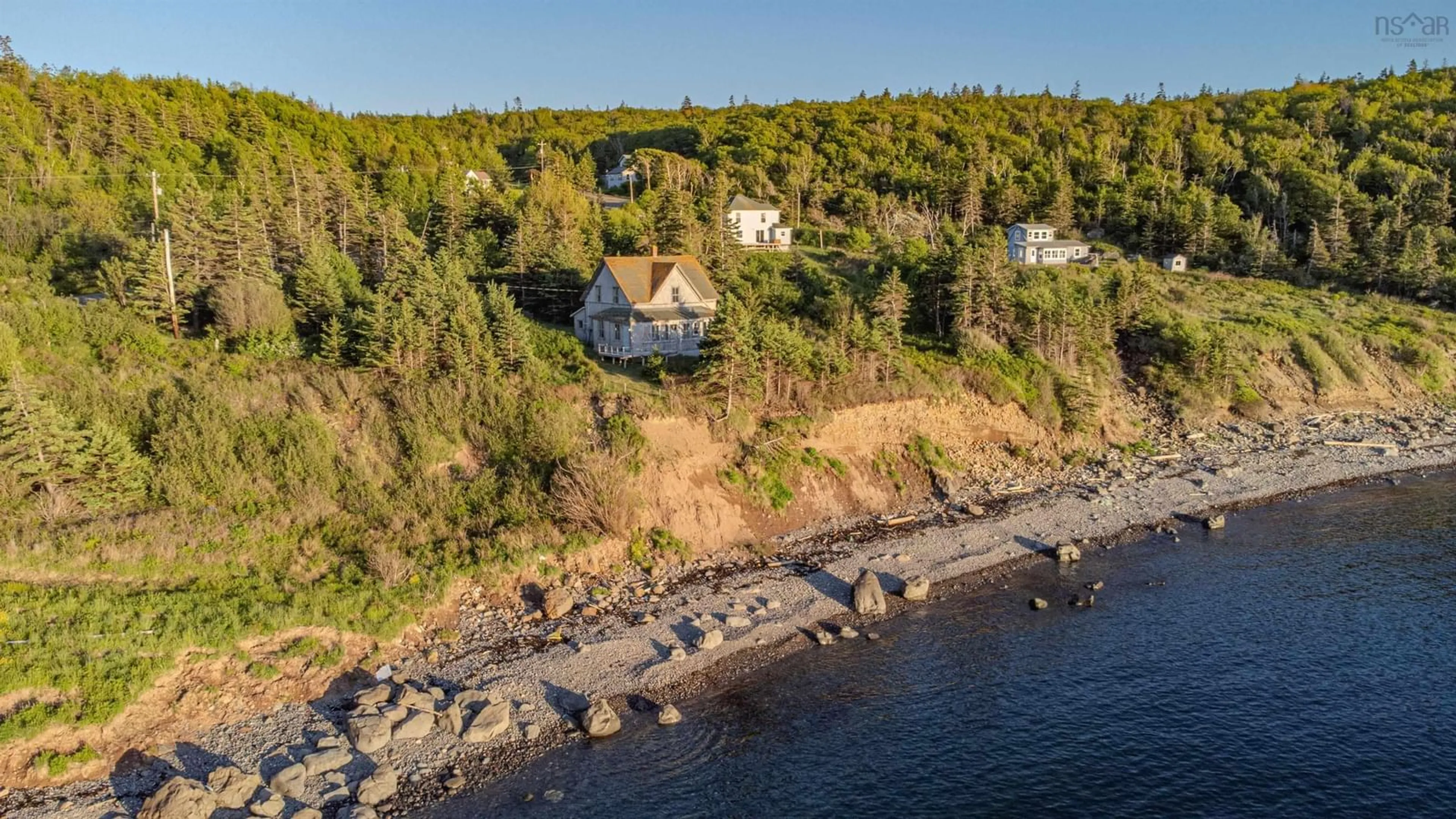 A pic from outside/outdoor area/front of a property/back of a property/a pic from drone, water/lake/river/ocean view for 223 Whale Cove Road, Whale Cove Nova Scotia B0V 1E0