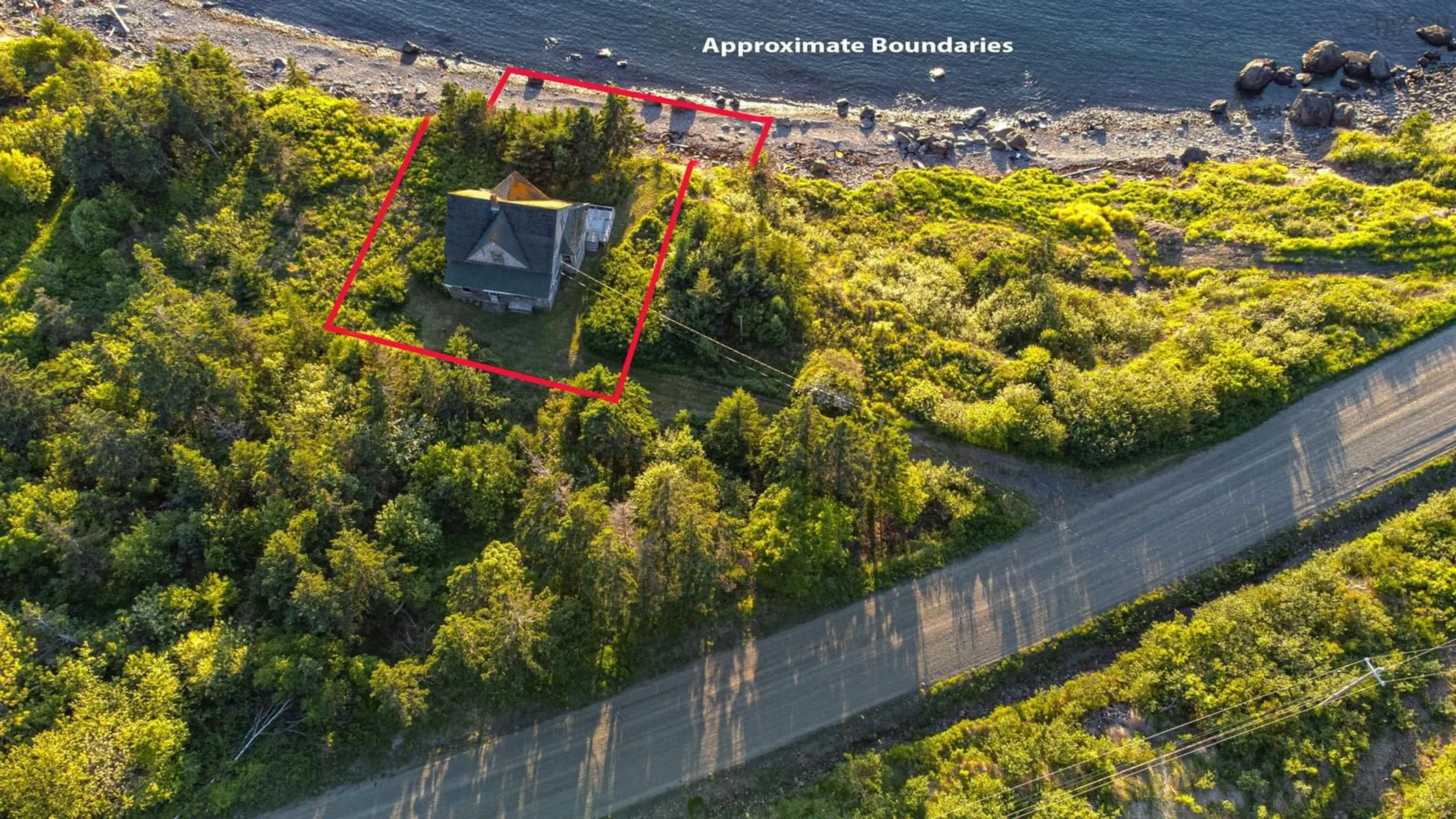 A pic from outside/outdoor area/front of a property/back of a property/a pic from drone, water/lake/river/ocean view for 223 Whale Cove Road, Whale Cove Nova Scotia B0V 1E0