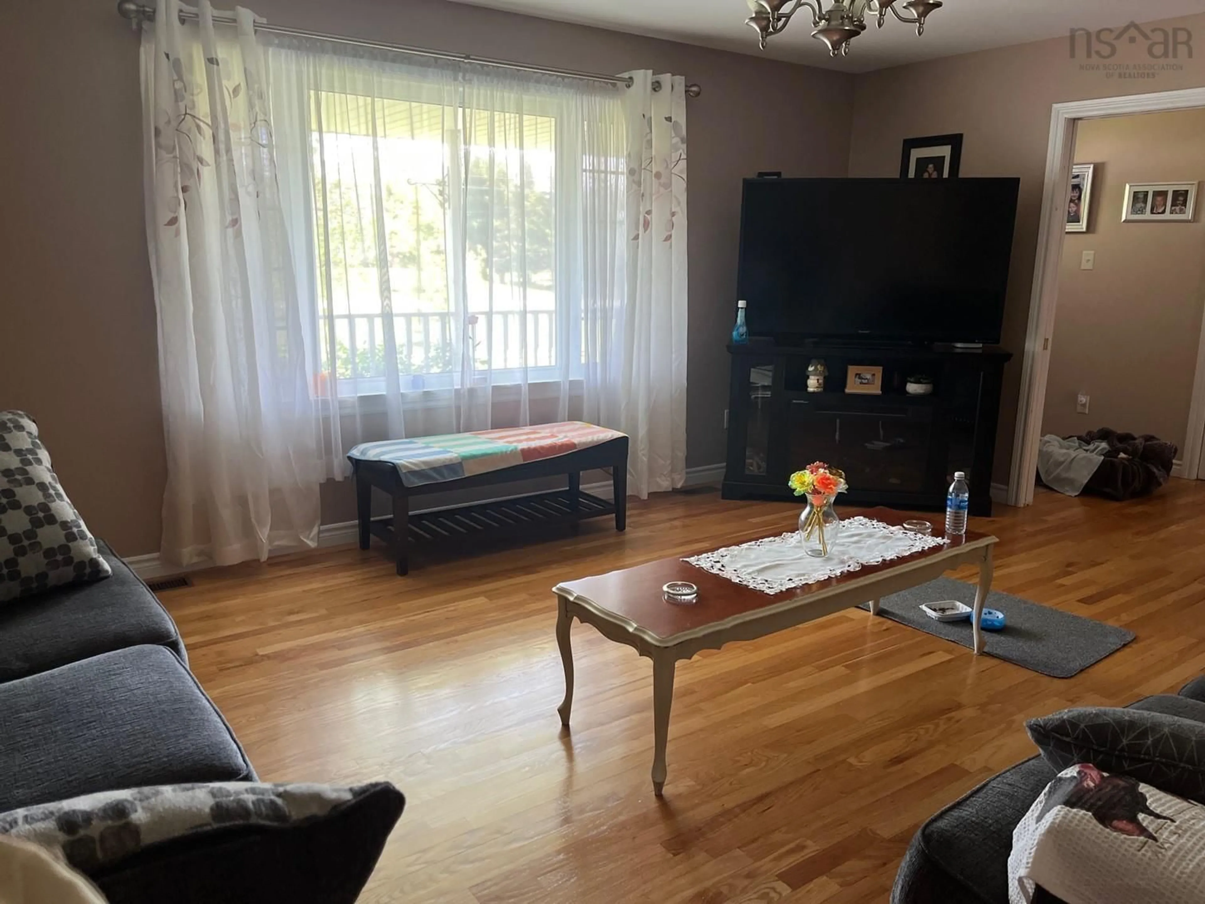 Living room with furniture, wood/laminate floor for 27 Sunnybrook Dr, Onslow Mountain Nova Scotia B6L 6T7