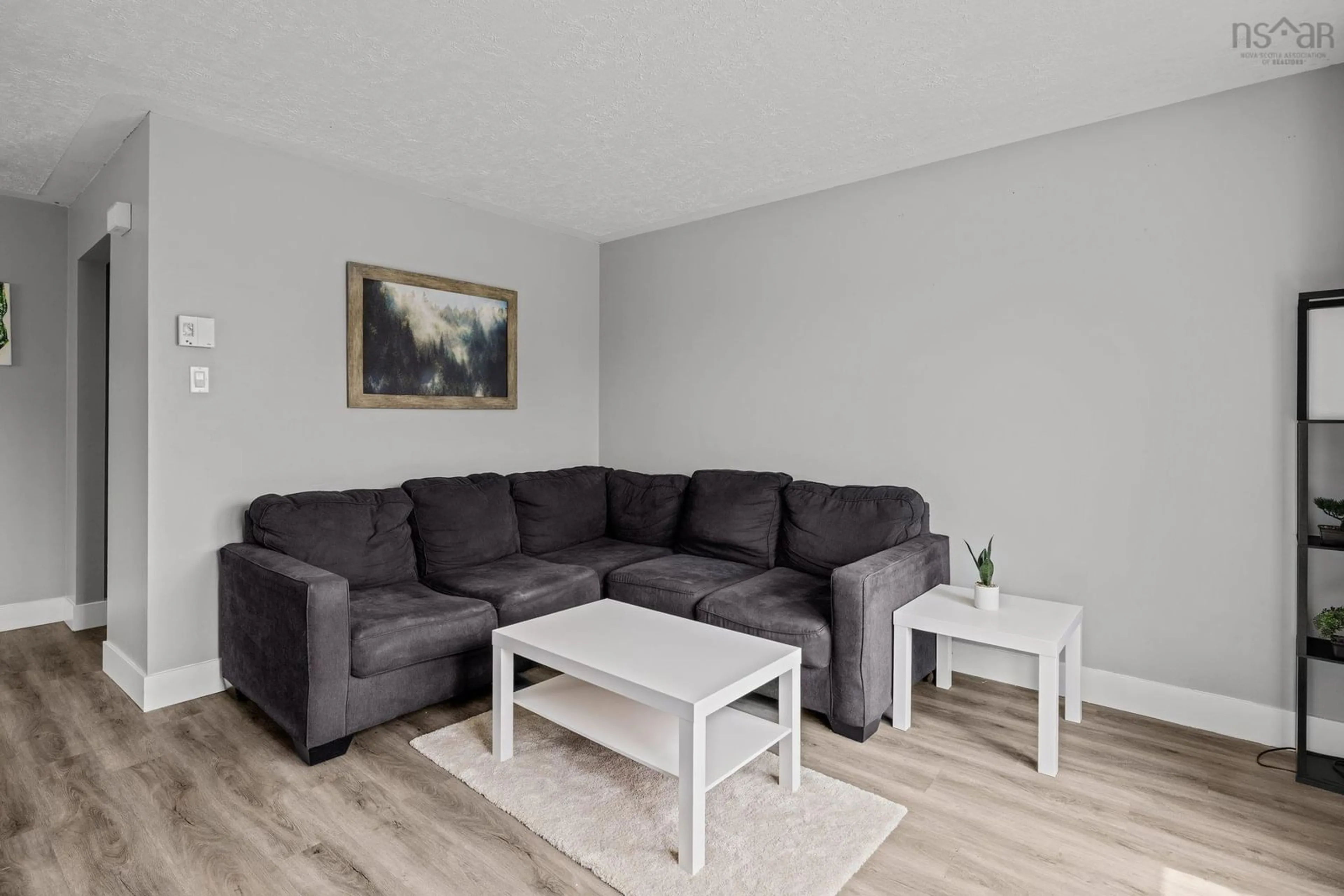 Living room with furniture, wood/laminate floor for 67 Blockade Cir, Eastern Passage Nova Scotia B3G 1C4