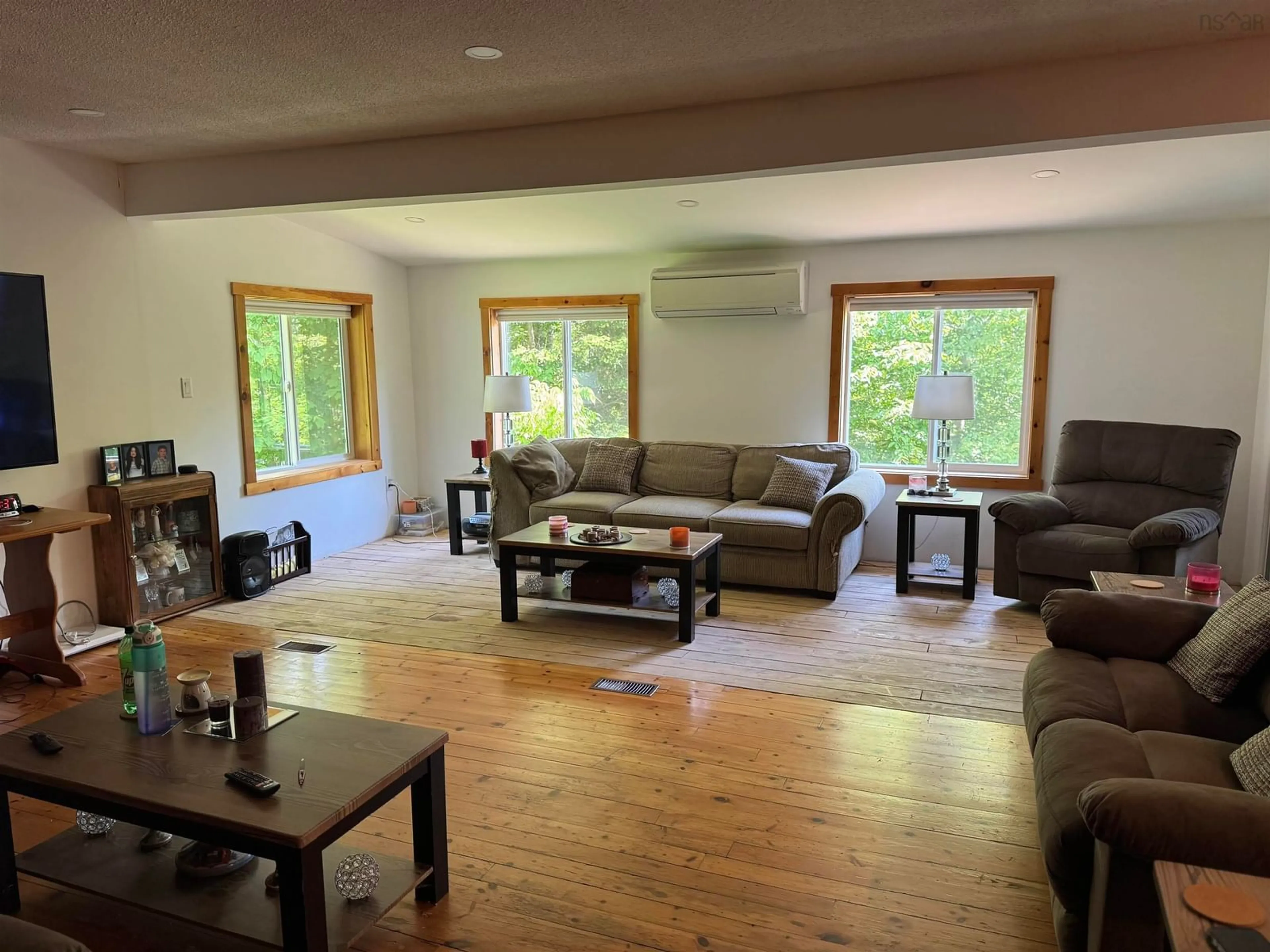 Living room with furniture, wood/laminate floor for 8 Birch Hill Rd #Lot 7, Maplewood Nova Scotia B0R 1A0