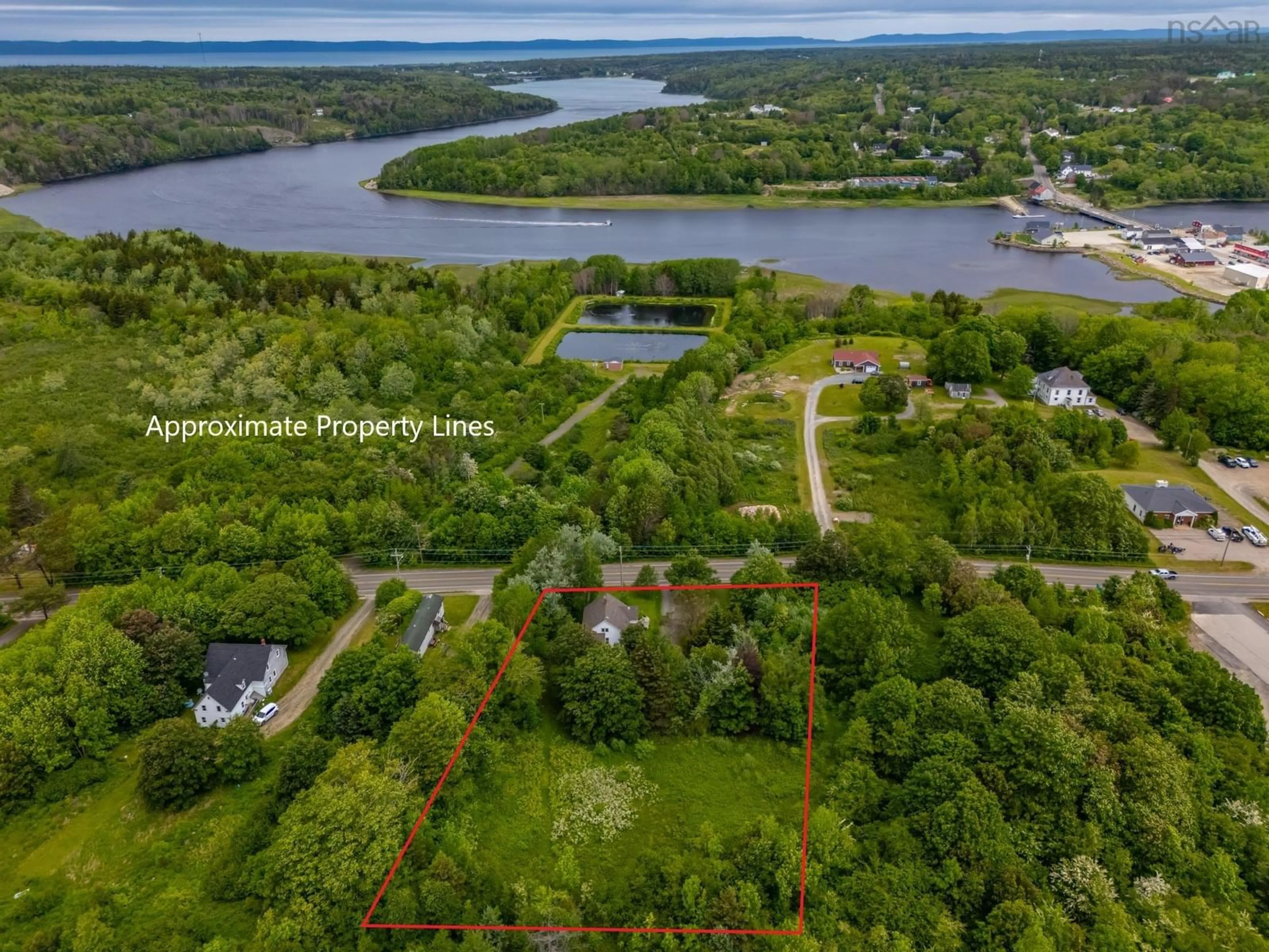 A pic from outside/outdoor area/front of a property/back of a property/a pic from drone, water/lake/river/ocean view for 4422 Highway 1, Weymouth Nova Scotia B0W 3T0