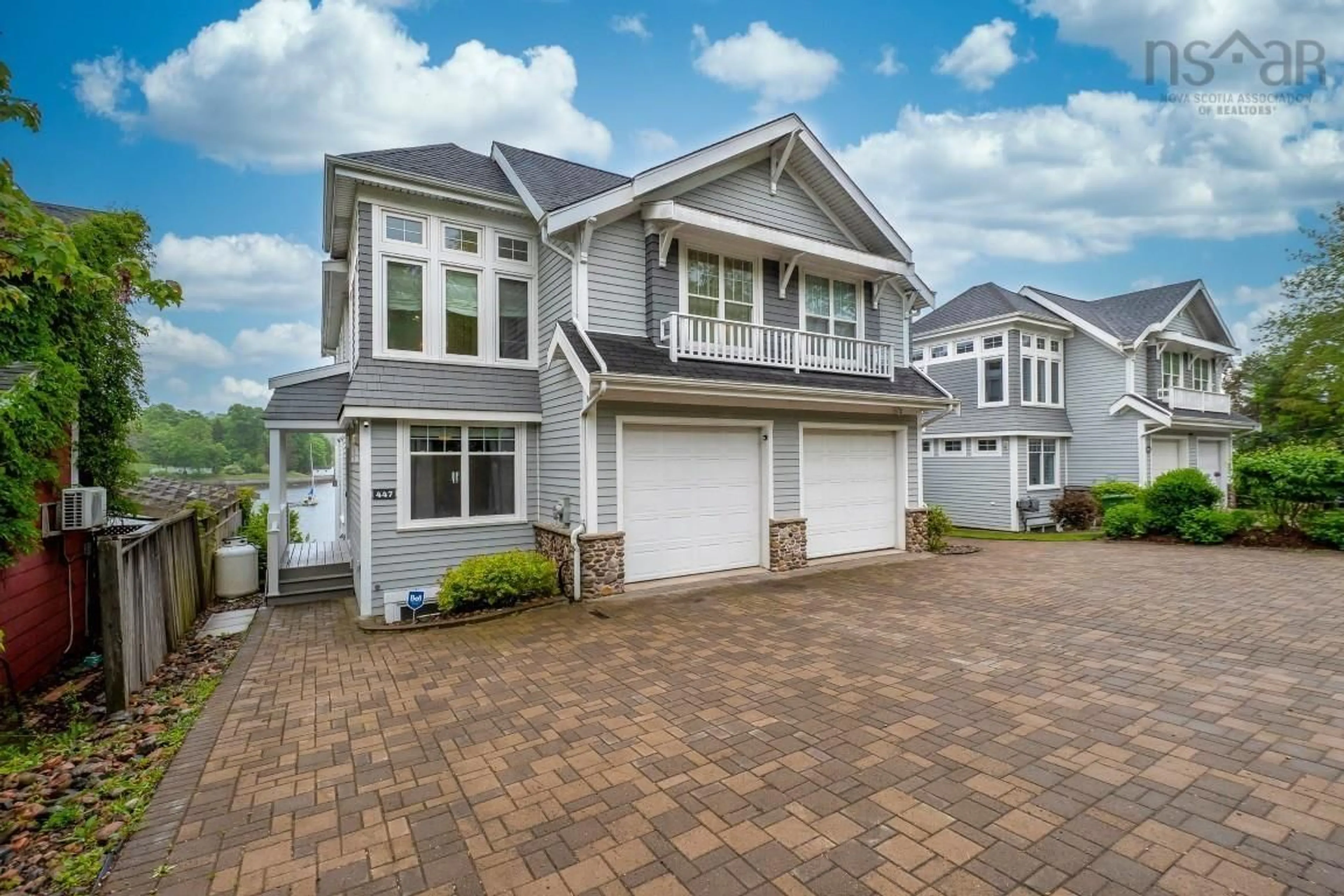 Home with vinyl exterior material, street for 447 Shore Dr, Bedford Nova Scotia B4A 2C7