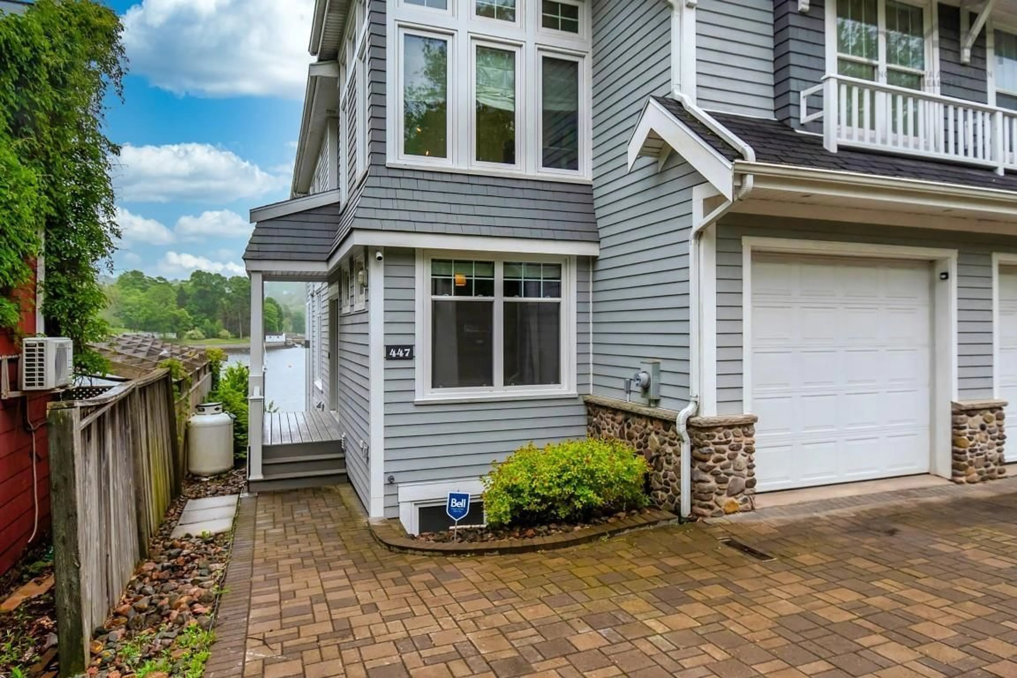 Home with vinyl exterior material, street for 447 Shore Dr, Bedford Nova Scotia B4A 2C7