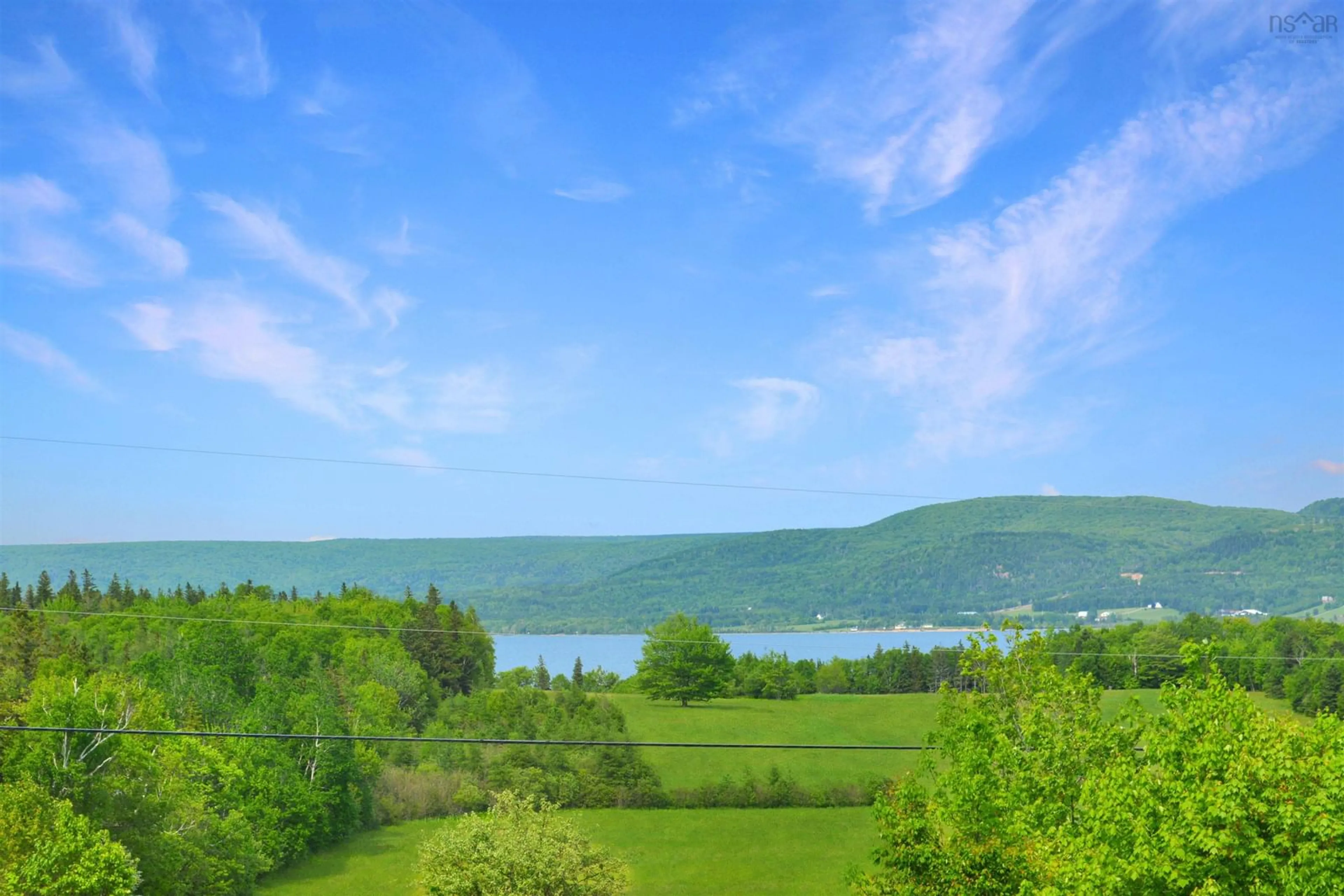 A pic from outside/outdoor area/front of a property/back of a property/a pic from drone, water/lake/river/ocean view for 2968 West Lake Ainslie Rd, West Lake Ainslie Nova Scotia B0E 1N0