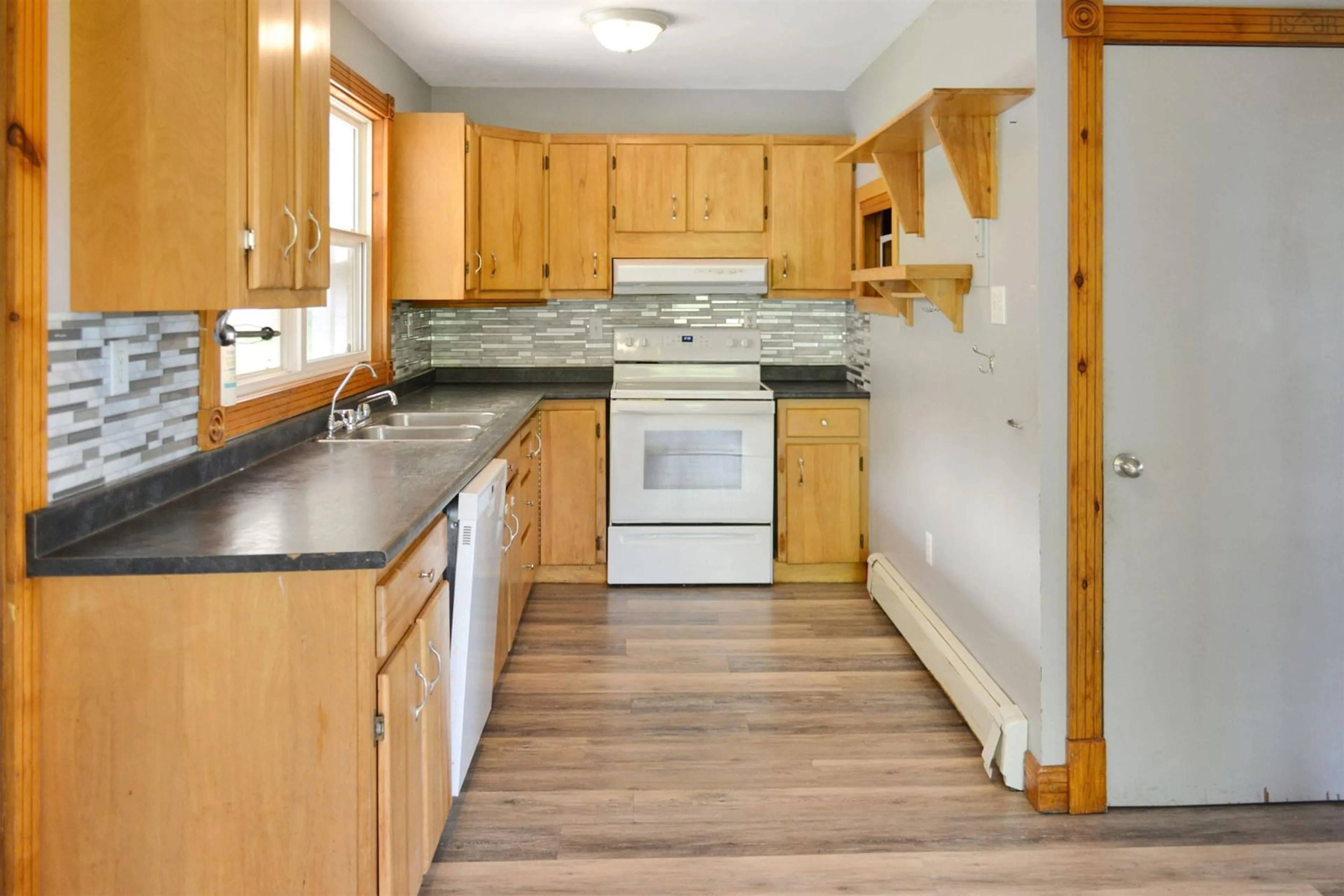 Standard kitchen, wood/laminate floor for 2968 West Lake Ainslie Rd, West Lake Ainslie Nova Scotia B0E 1N0