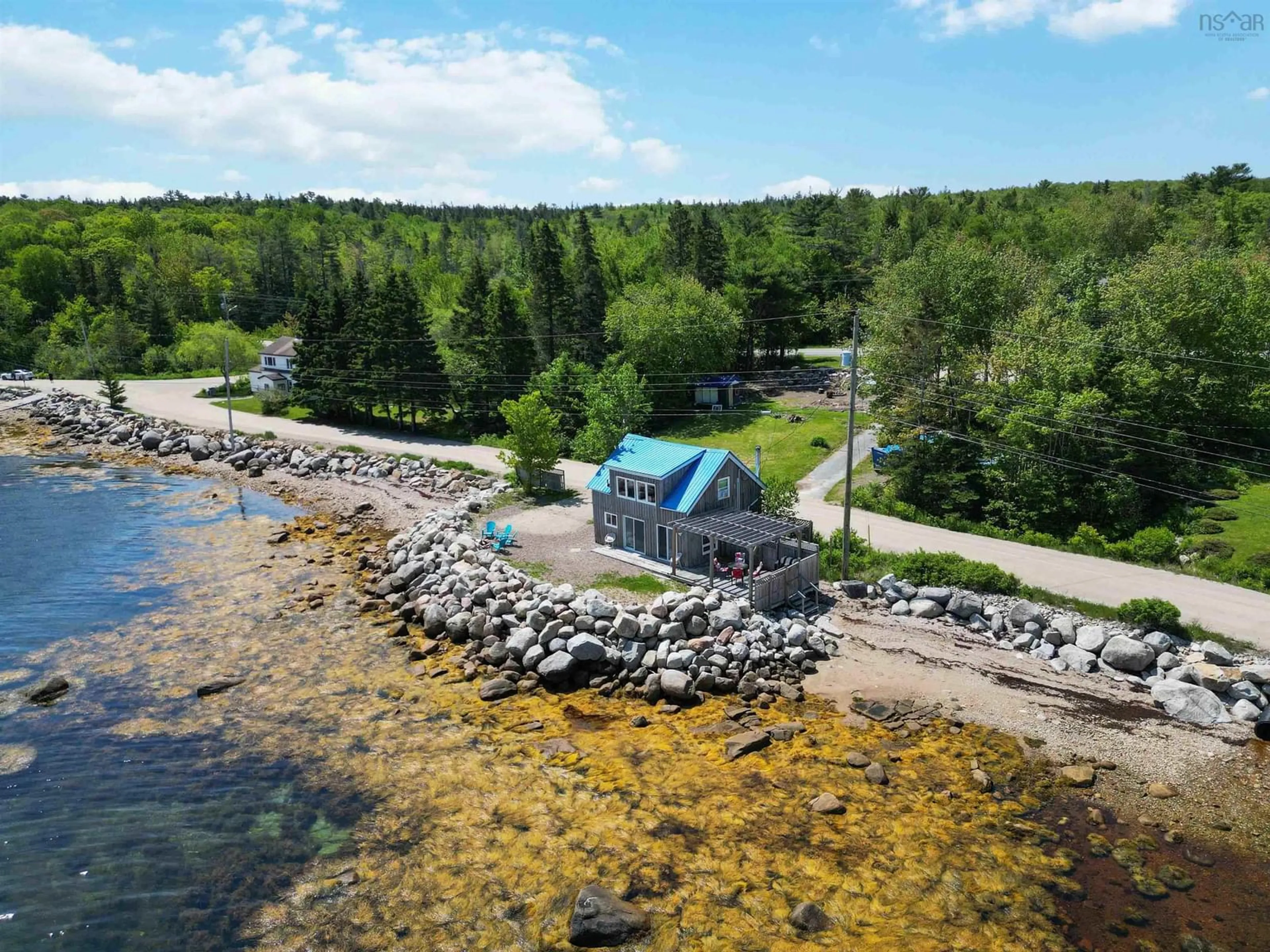 A pic from outside/outdoor area/front of a property/back of a property/a pic from drone, water/lake/river/ocean view for 299 Mill Cove Shore Rd, Mill Cove Nova Scotia B0J 1T0