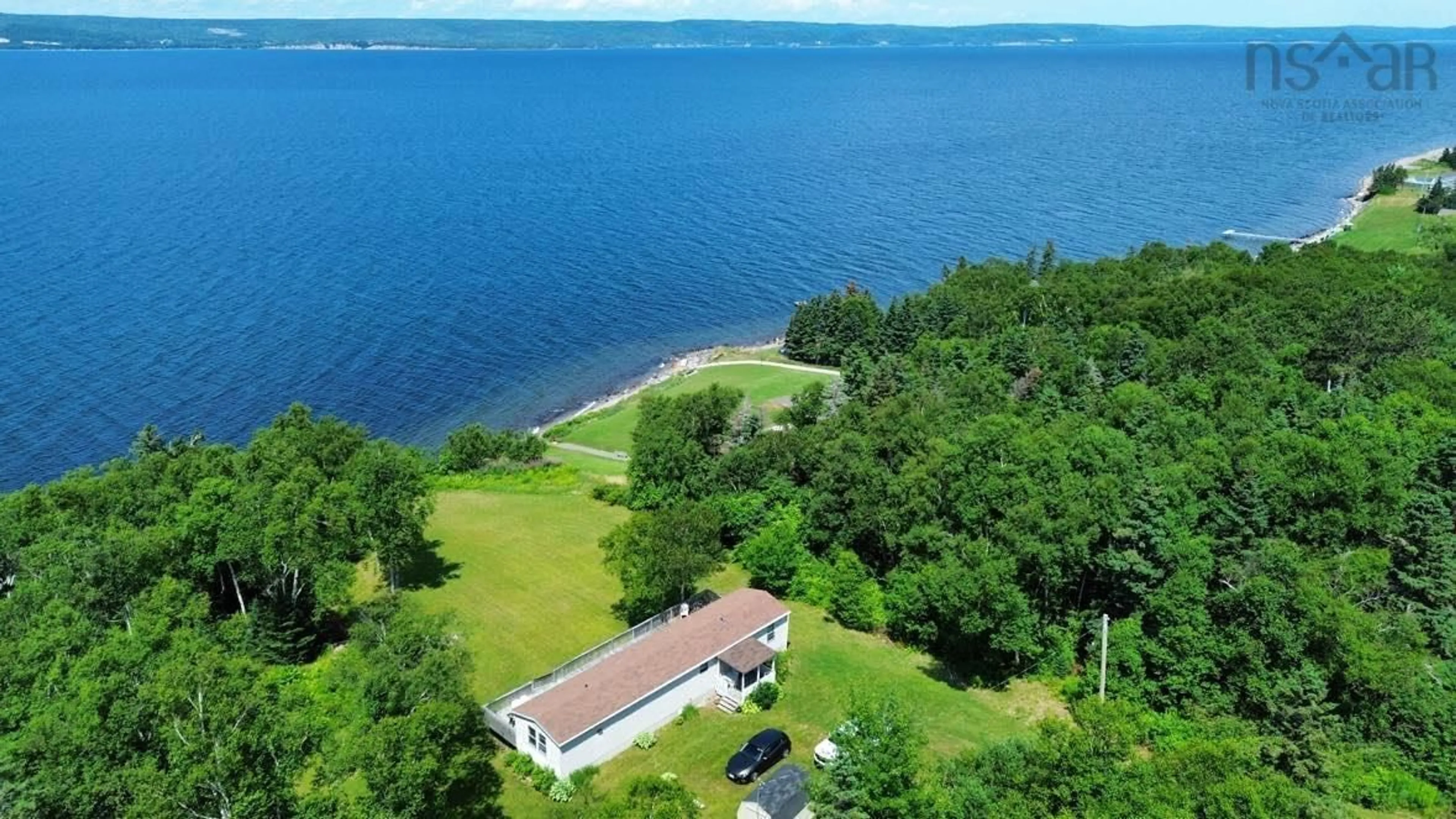 A pic from outside/outdoor area/front of a property/back of a property/a pic from drone, water/lake/river/ocean view for 8934 East Bay Hwy, Middle Cape Nova Scotia B1J 2A4