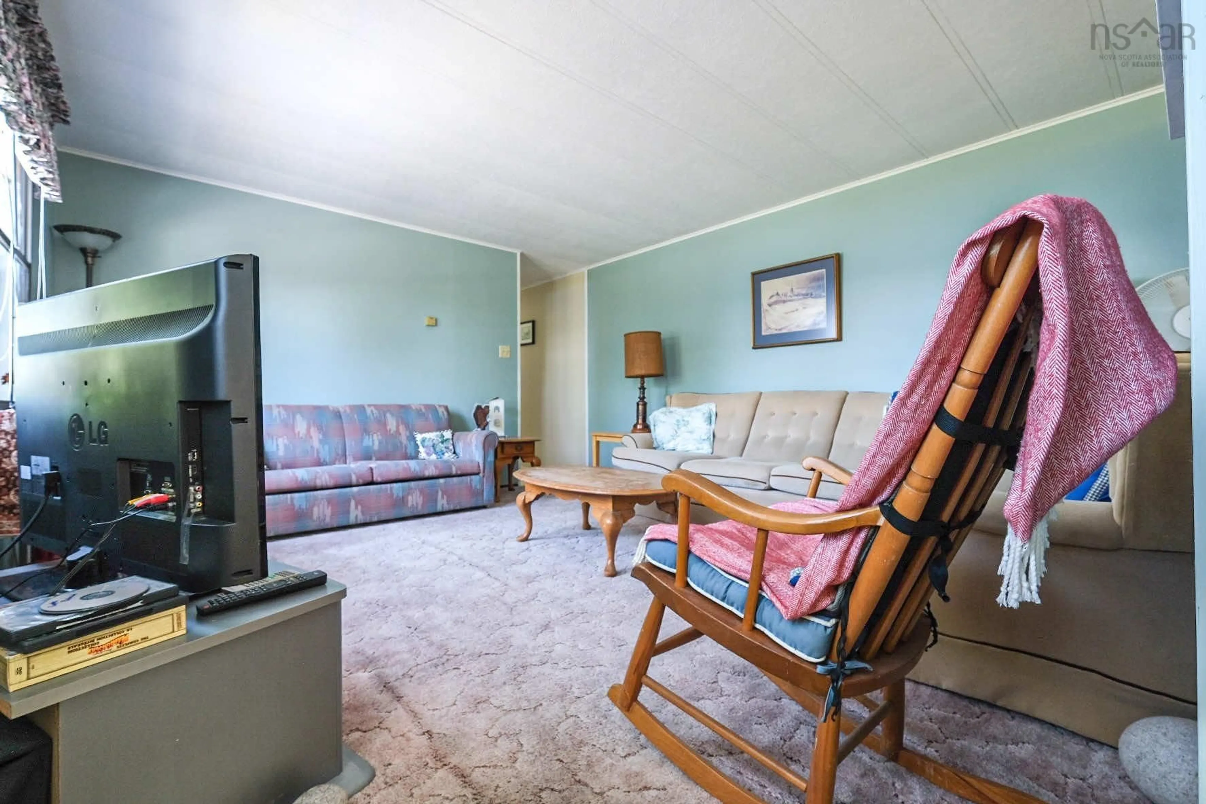 Living room with furniture, unknown for 8934 East Bay Hwy, Middle Cape Nova Scotia B1J 2A4