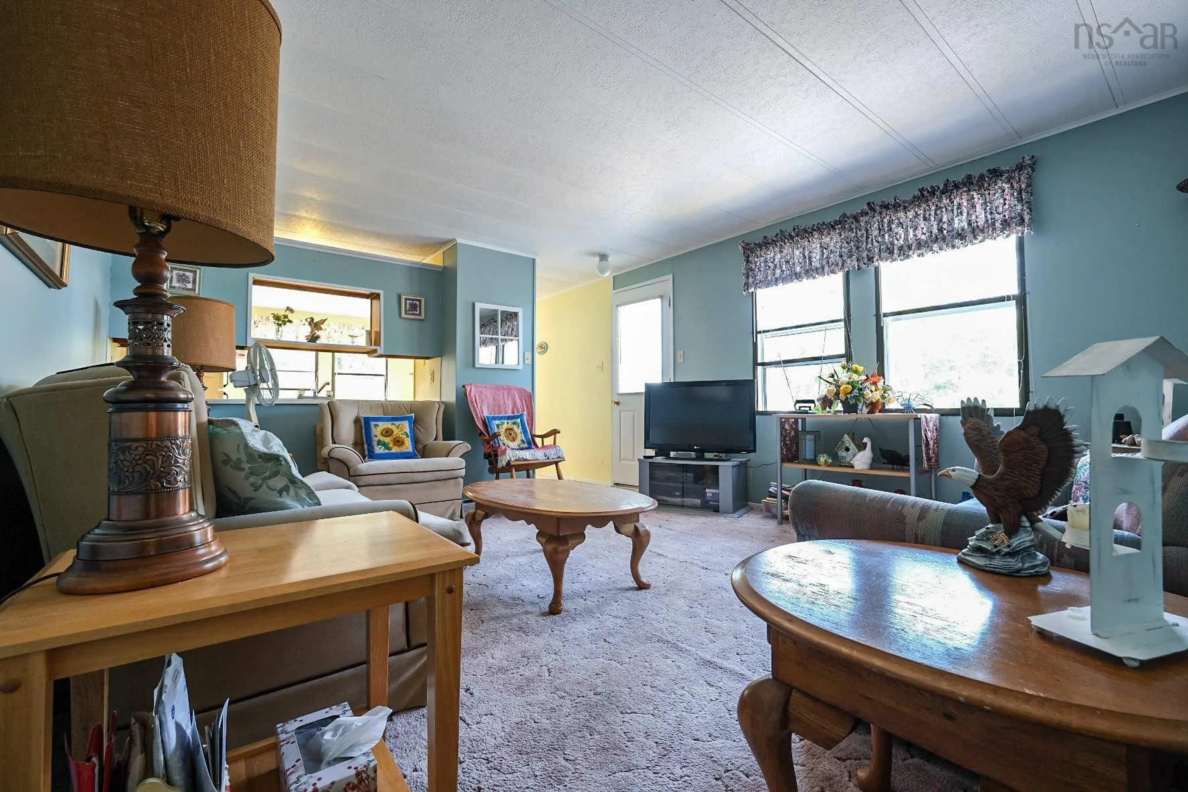 Living room with furniture, unknown for 8934 East Bay Hwy, Middle Cape Nova Scotia B1J 2A4