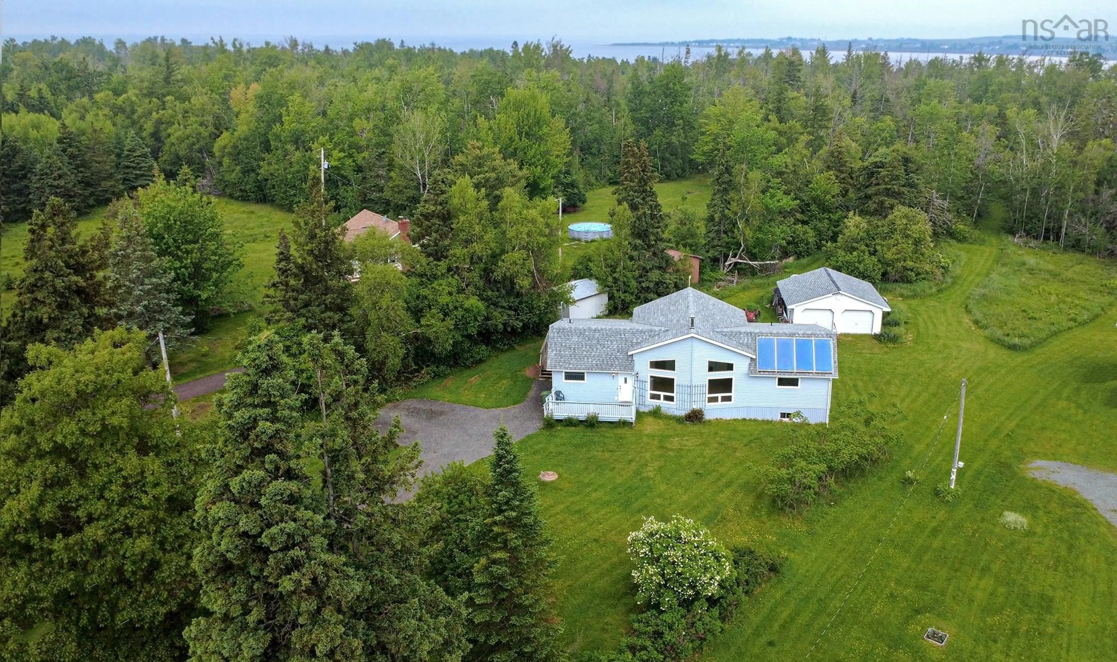 A pic from outside/outdoor area/front of a property/back of a property/a pic from drone, water/lake/river/ocean view for 9525 Highway 6, Pugwash Nova Scotia B0M 0A3