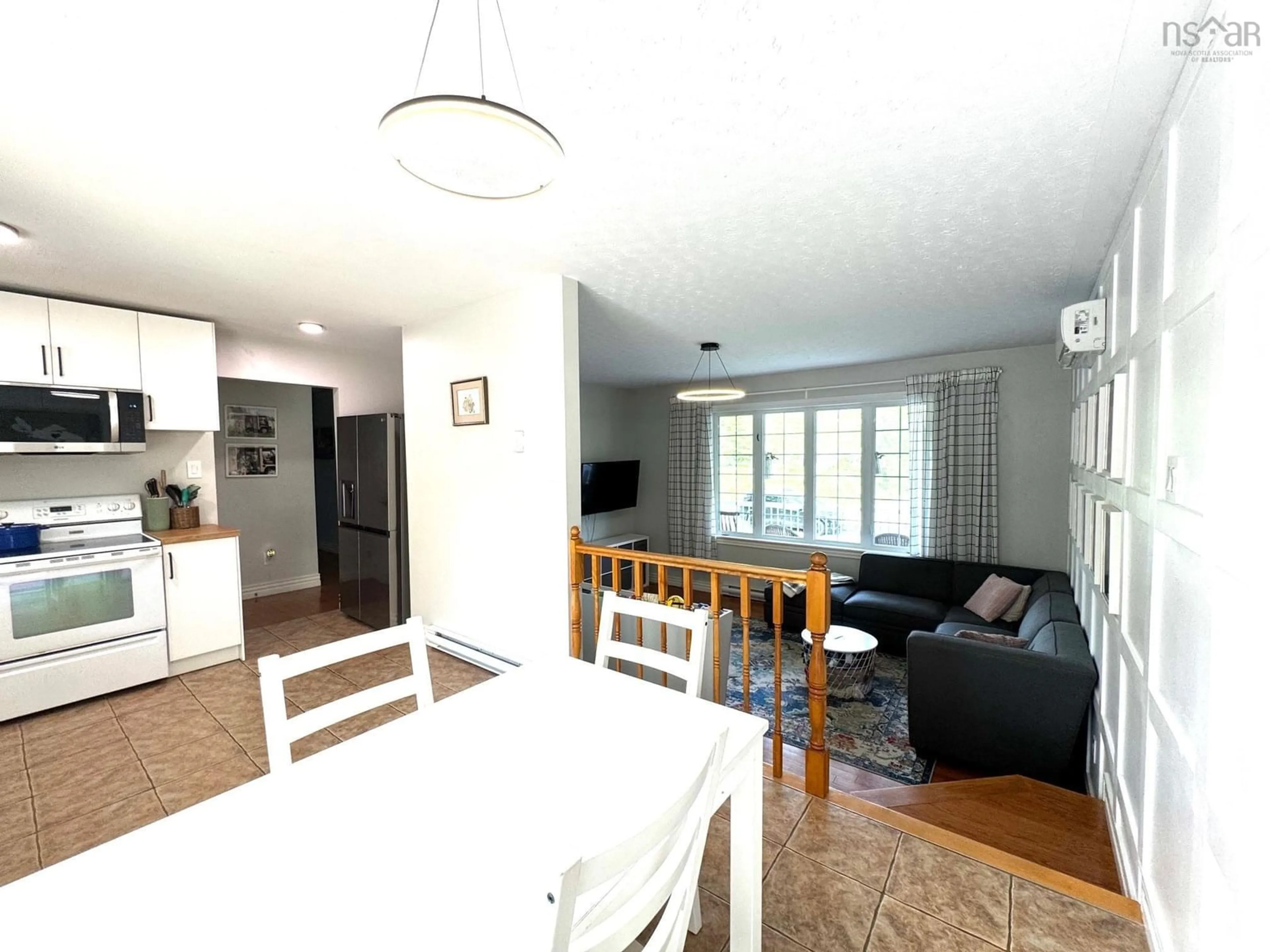 Living room with furniture, wood/laminate floor for 27 Frederick Allen Dr, East Hants Nova Scotia B2S 1X7