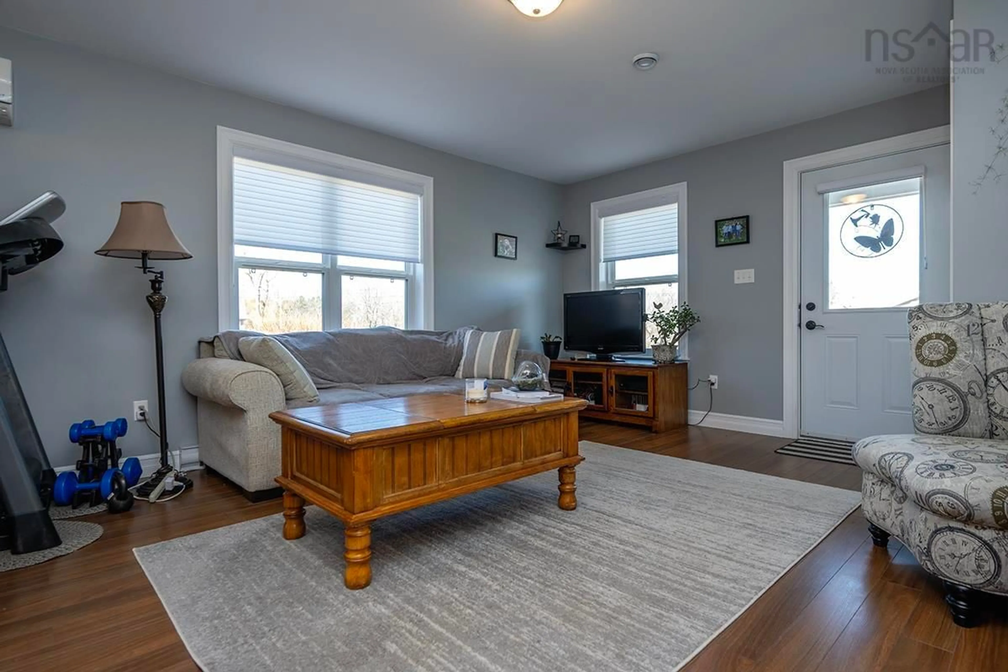 Living room with furniture, wood/laminate floor for 24 Mariners Dr, Hantsport Nova Scotia B0P 1P0