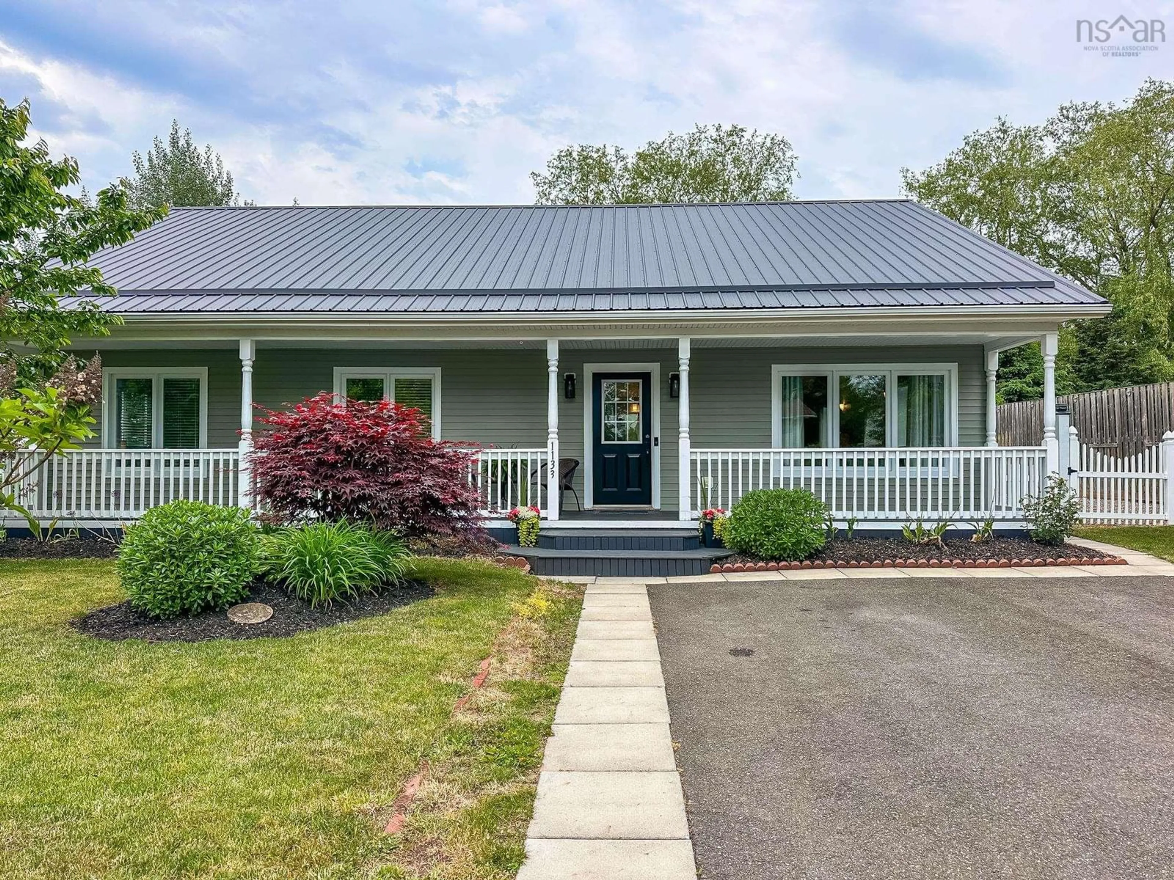 Home with vinyl exterior material, street for 1133 Chapel St, Canning Nova Scotia B0P 1H0