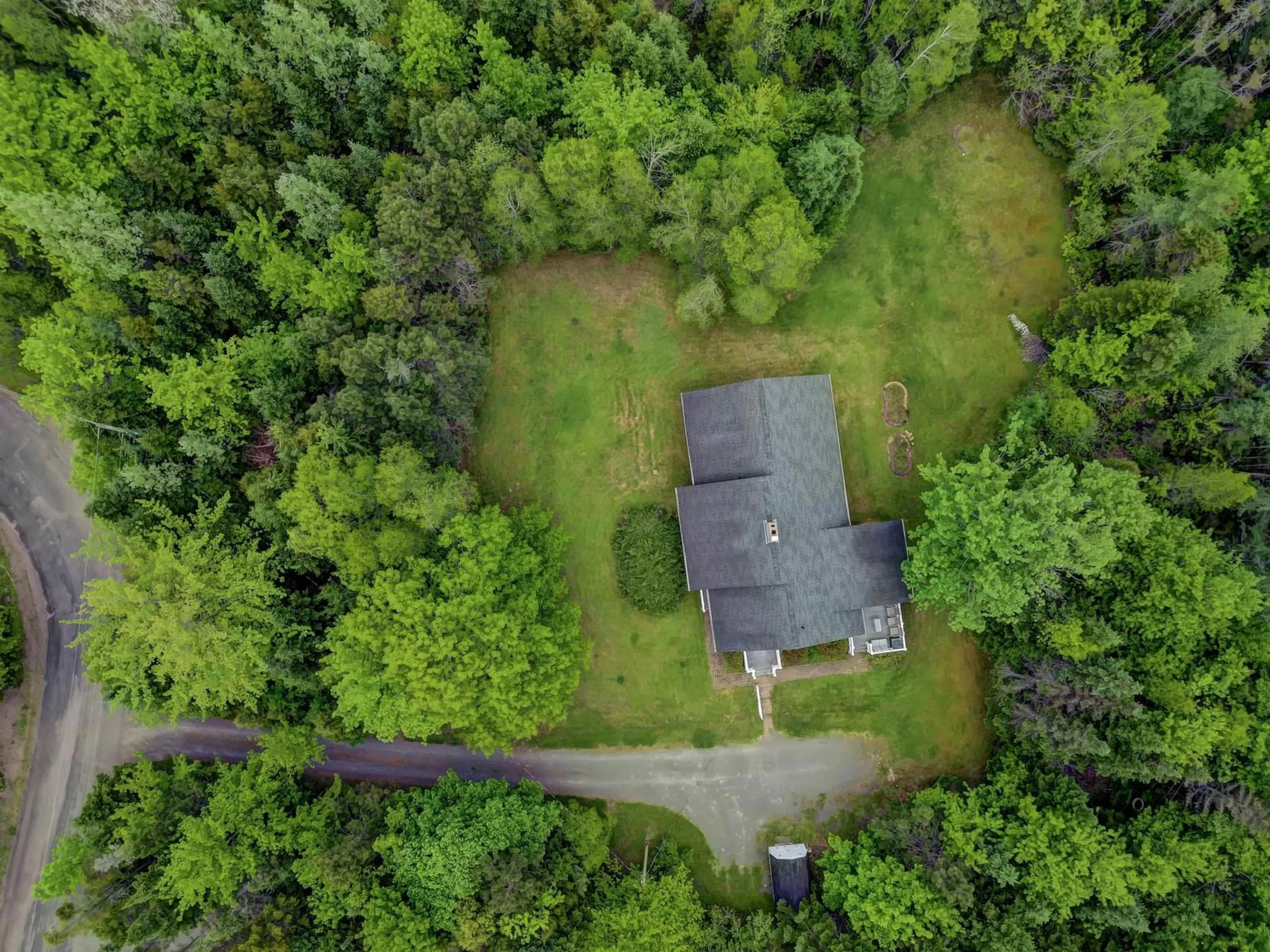 A pic from outside/outdoor area/front of a property/back of a property/a pic from drone, forest/trees view for 122 Saxby Lane, Brookside NV B6L 2T2