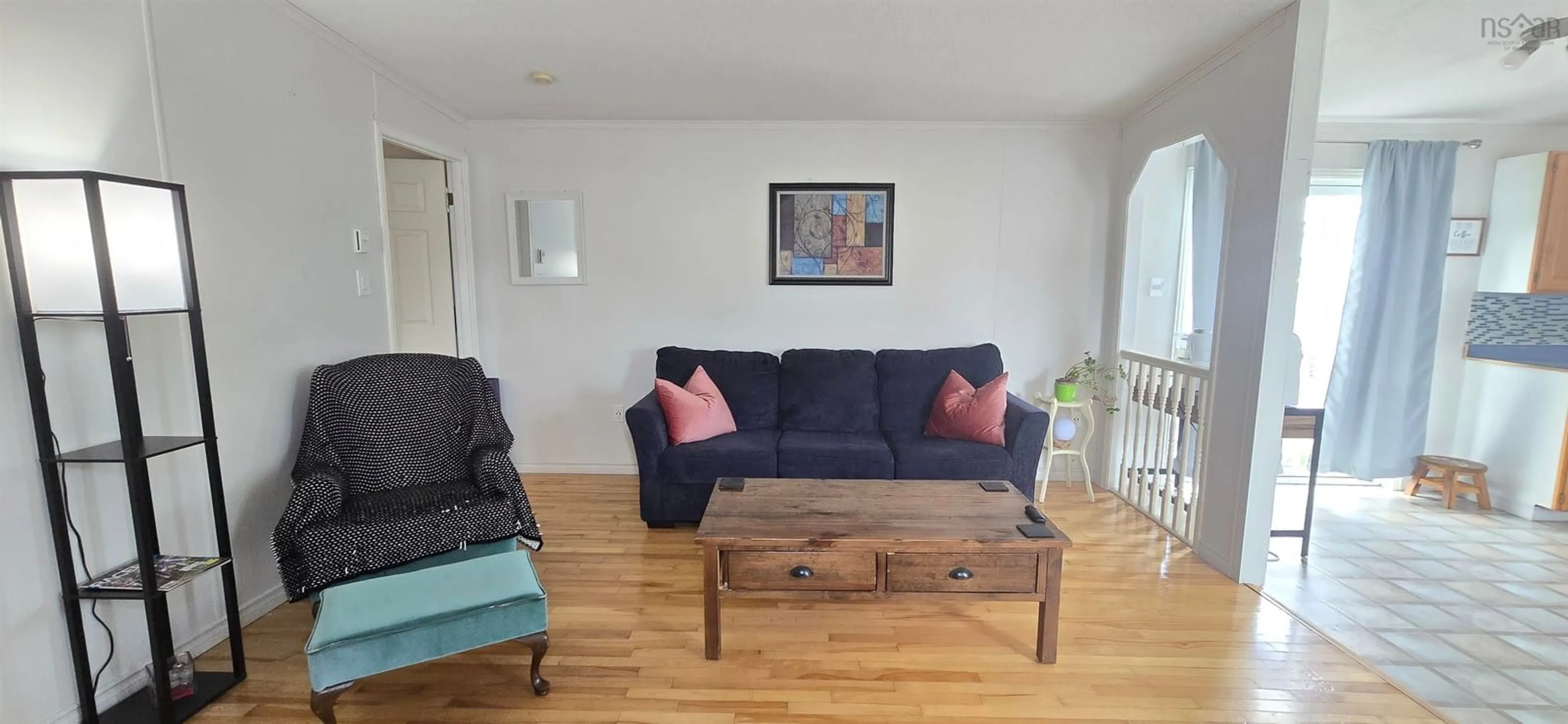 Living room with furniture, wood/laminate floor for 2061 Maple Crt, Coldbrook Nova Scotia B4R 1C2