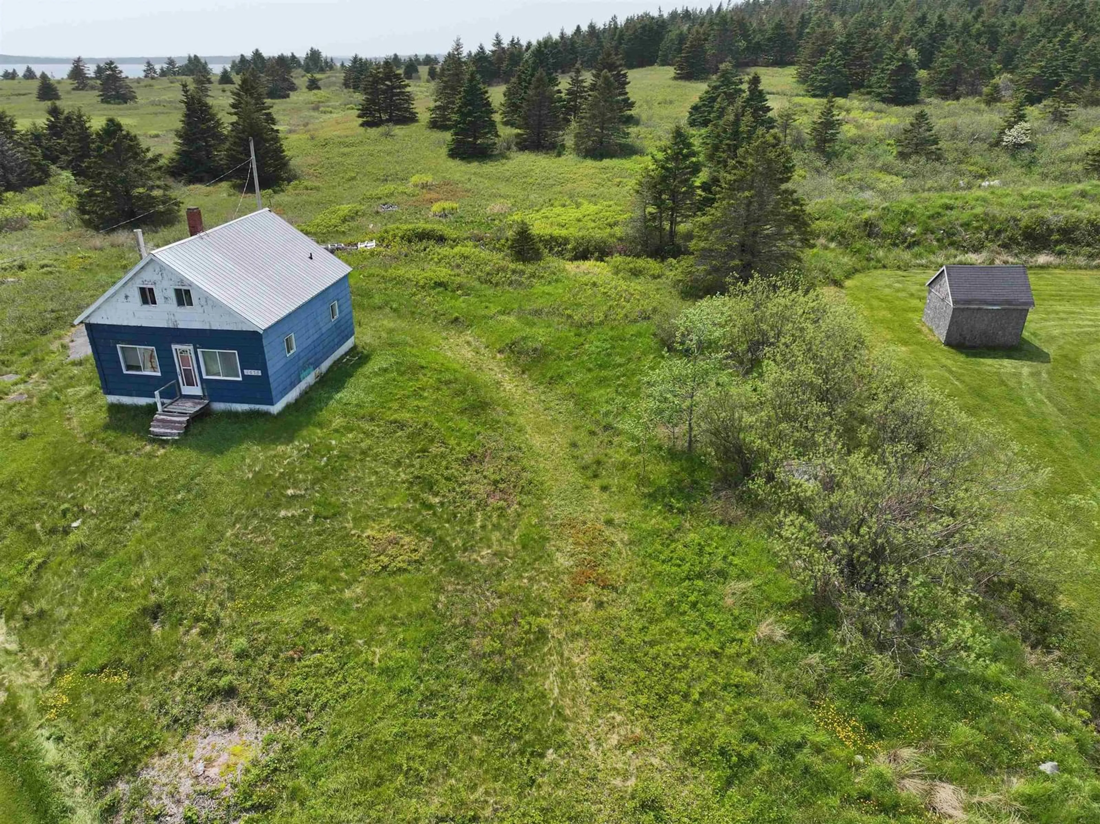 A pic from outside/outdoor area/front of a property/back of a property/a pic from drone, unknown for 1675 7 Hwy, Marie Joseph Nova Scotia B0J 2G0