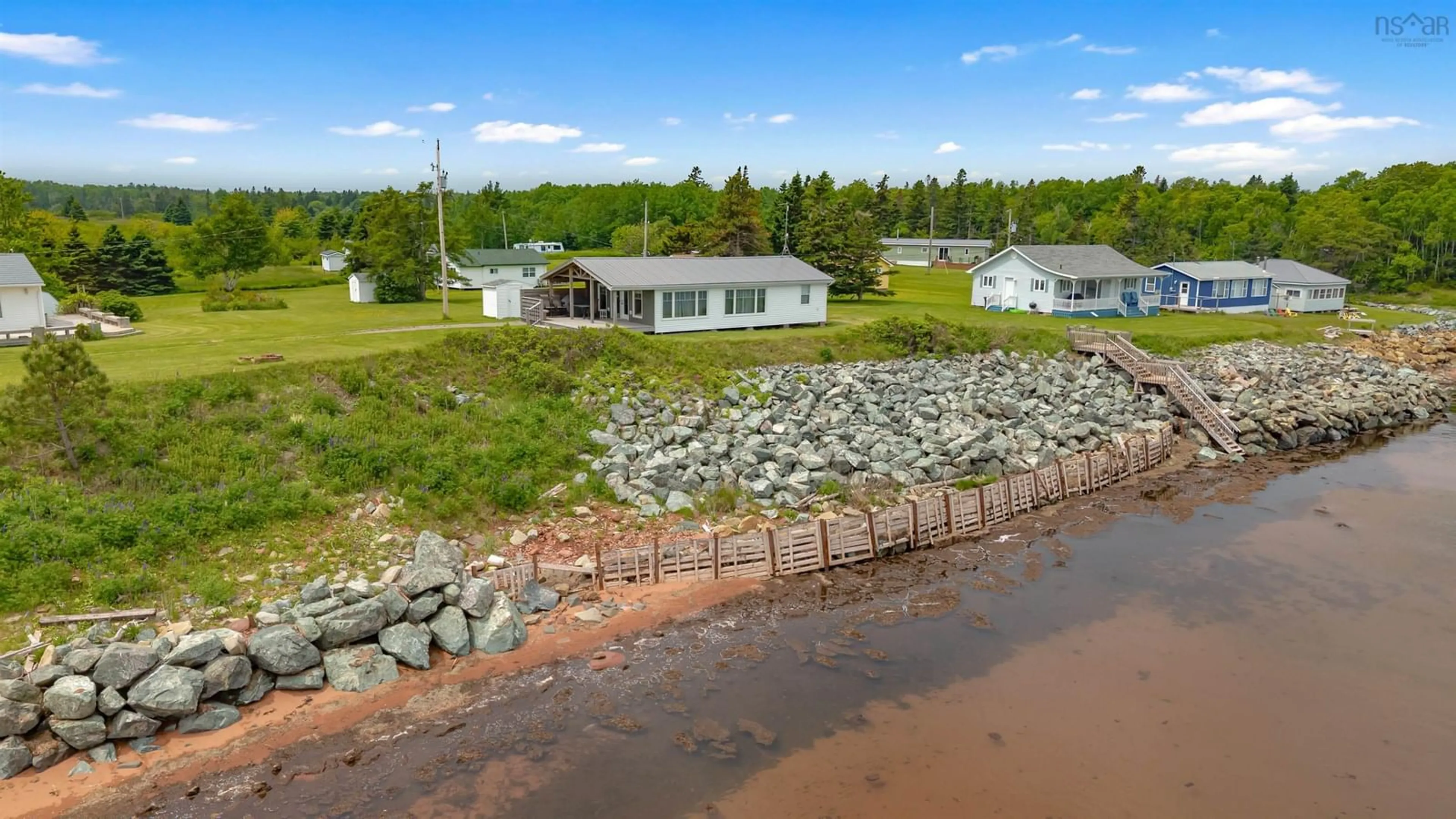 A pic from outside/outdoor area/front of a property/back of a property/a pic from drone, water/lake/river/ocean view for 97 Annabels Beach Lane, Amherst Shore Nova Scotia B0L 1E0