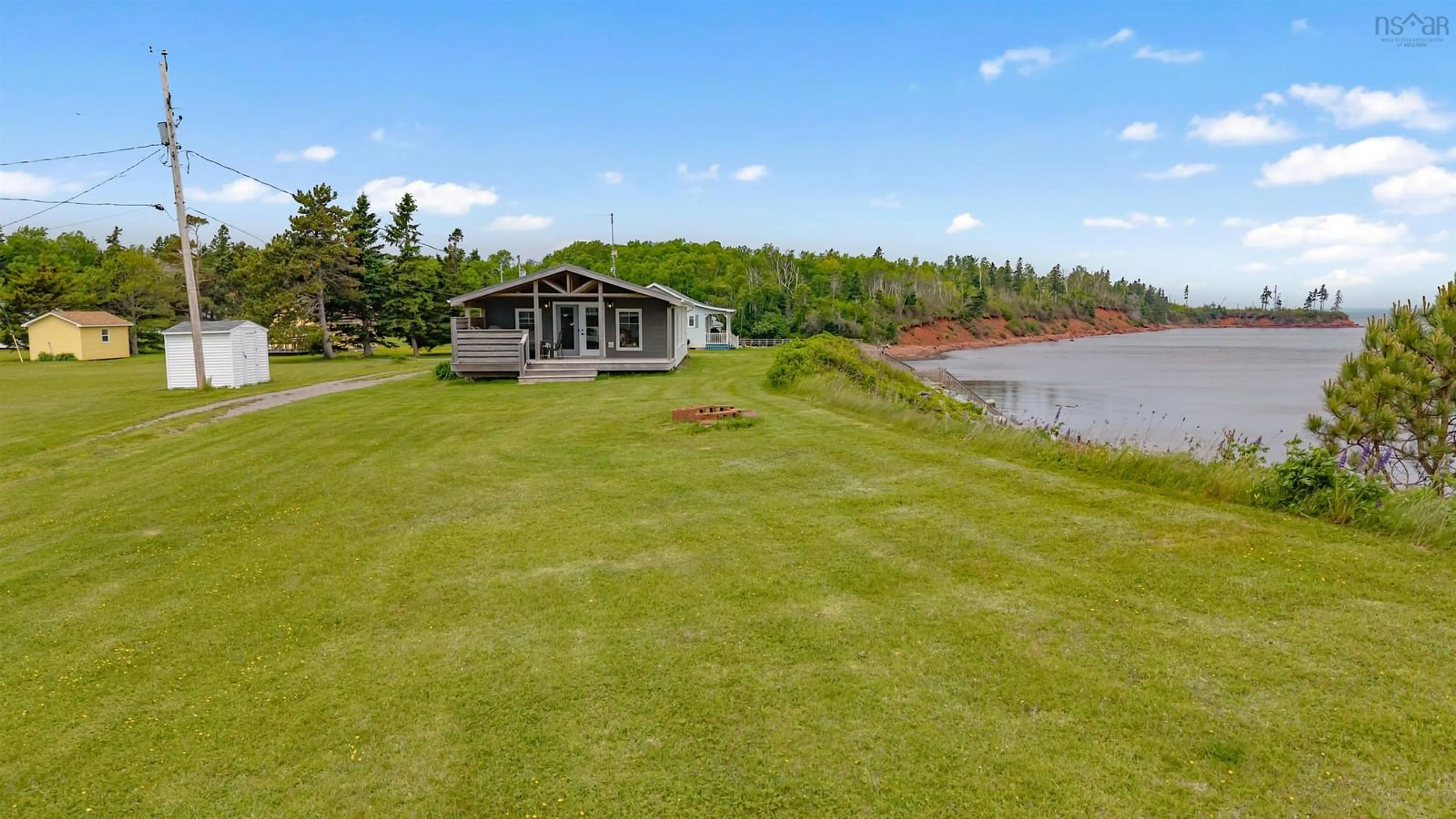 A pic from outside/outdoor area/front of a property/back of a property/a pic from drone, water/lake/river/ocean view for 97 Annabels Beach Lane, Amherst Shore Nova Scotia B0L 1E0