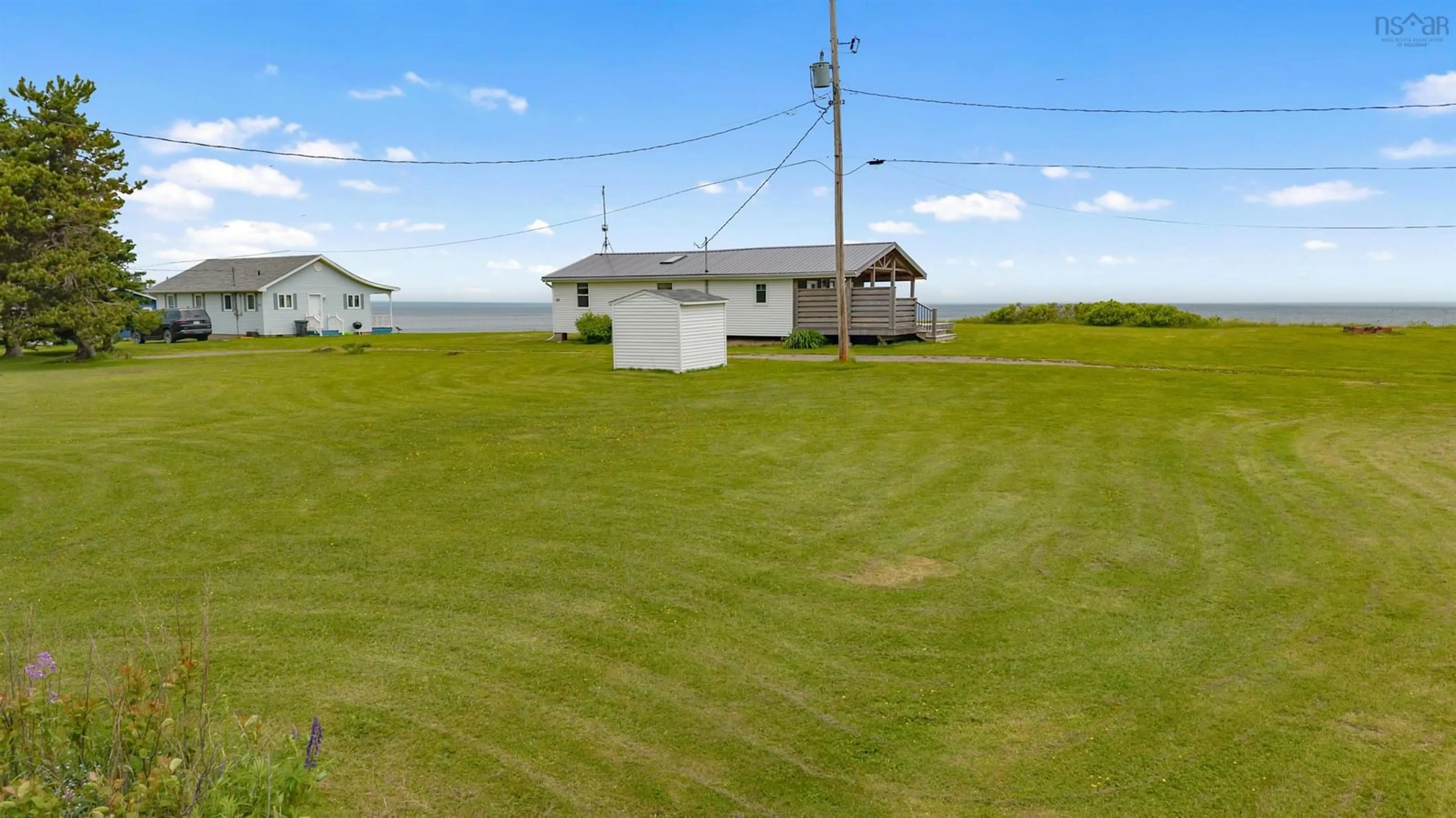 A pic from outside/outdoor area/front of a property/back of a property/a pic from drone, water/lake/river/ocean view for 97 Annabels Beach Lane, Amherst Shore Nova Scotia B0L 1E0