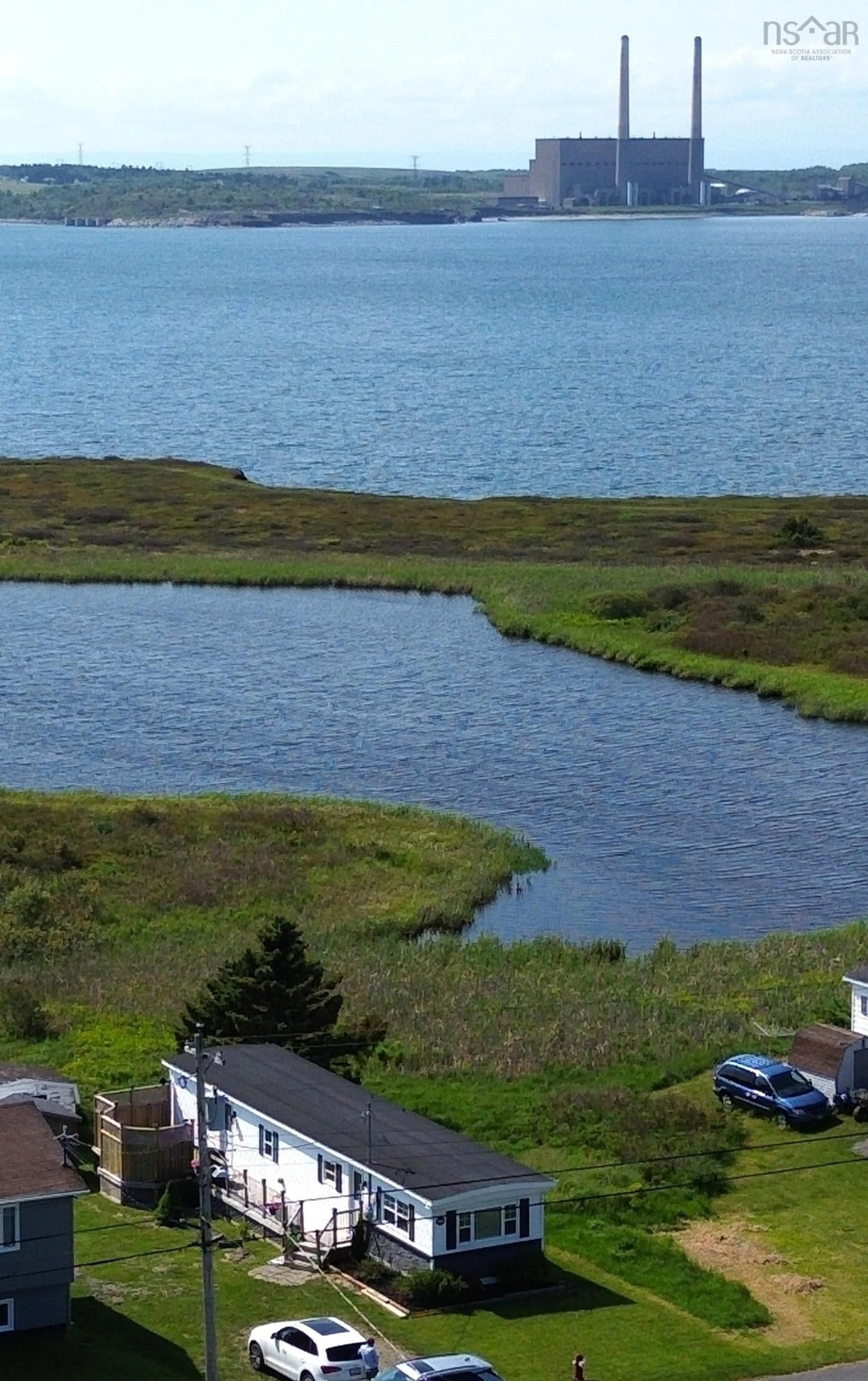 A pic from outside/outdoor area/front of a property/back of a property/a pic from drone, water/lake/river/ocean view for 127 Park St, Dominion Nova Scotia B1G 1R7