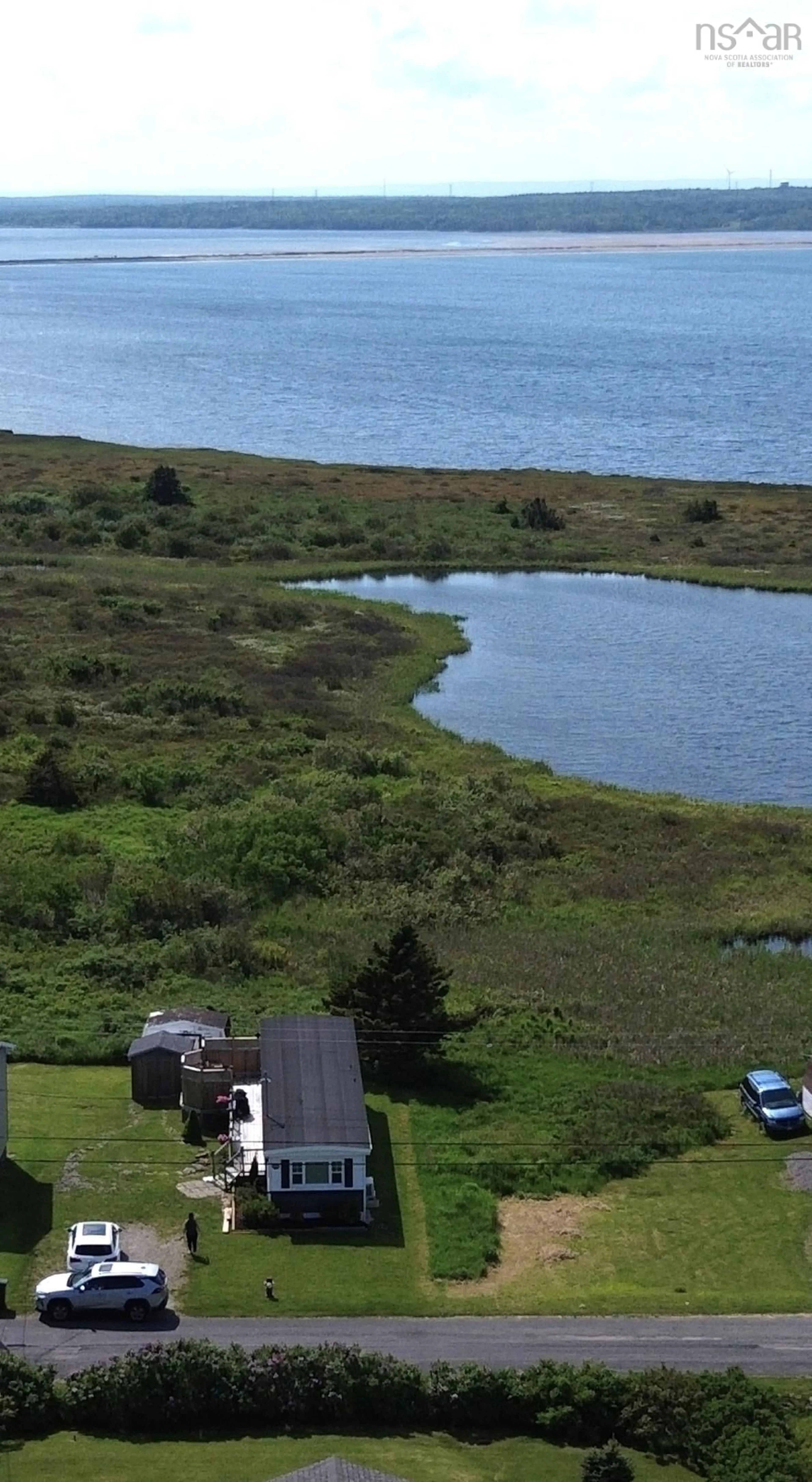 A pic from outside/outdoor area/front of a property/back of a property/a pic from drone, water/lake/river/ocean view for 127 Park St, Dominion Nova Scotia B1G 1R7