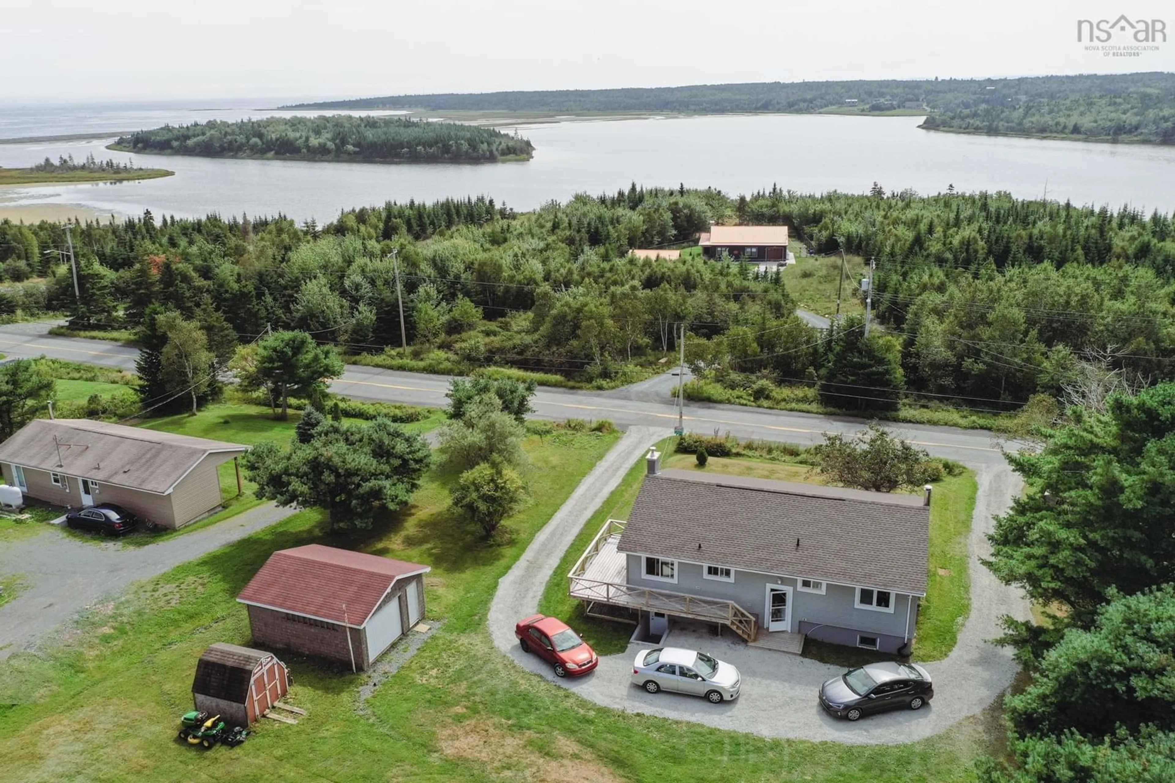 A pic from outside/outdoor area/front of a property/back of a property/a pic from drone, water/lake/river/ocean view for 1070 Cow Bay Rd, Cow Bay Nova Scotia B3G 1L5