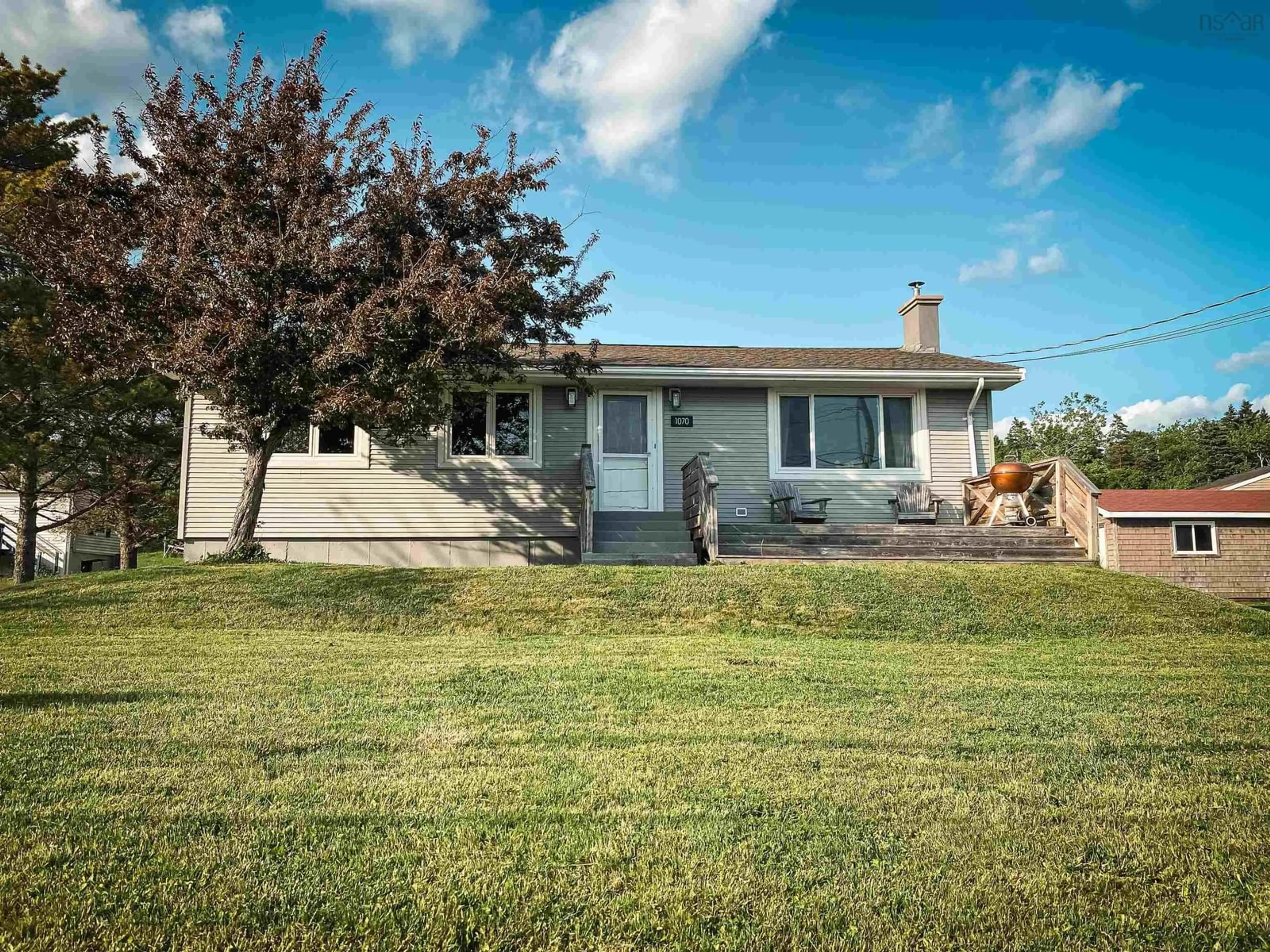Home with vinyl exterior material, street for 1070 Cow Bay Rd, Cow Bay Nova Scotia B3G 1L5