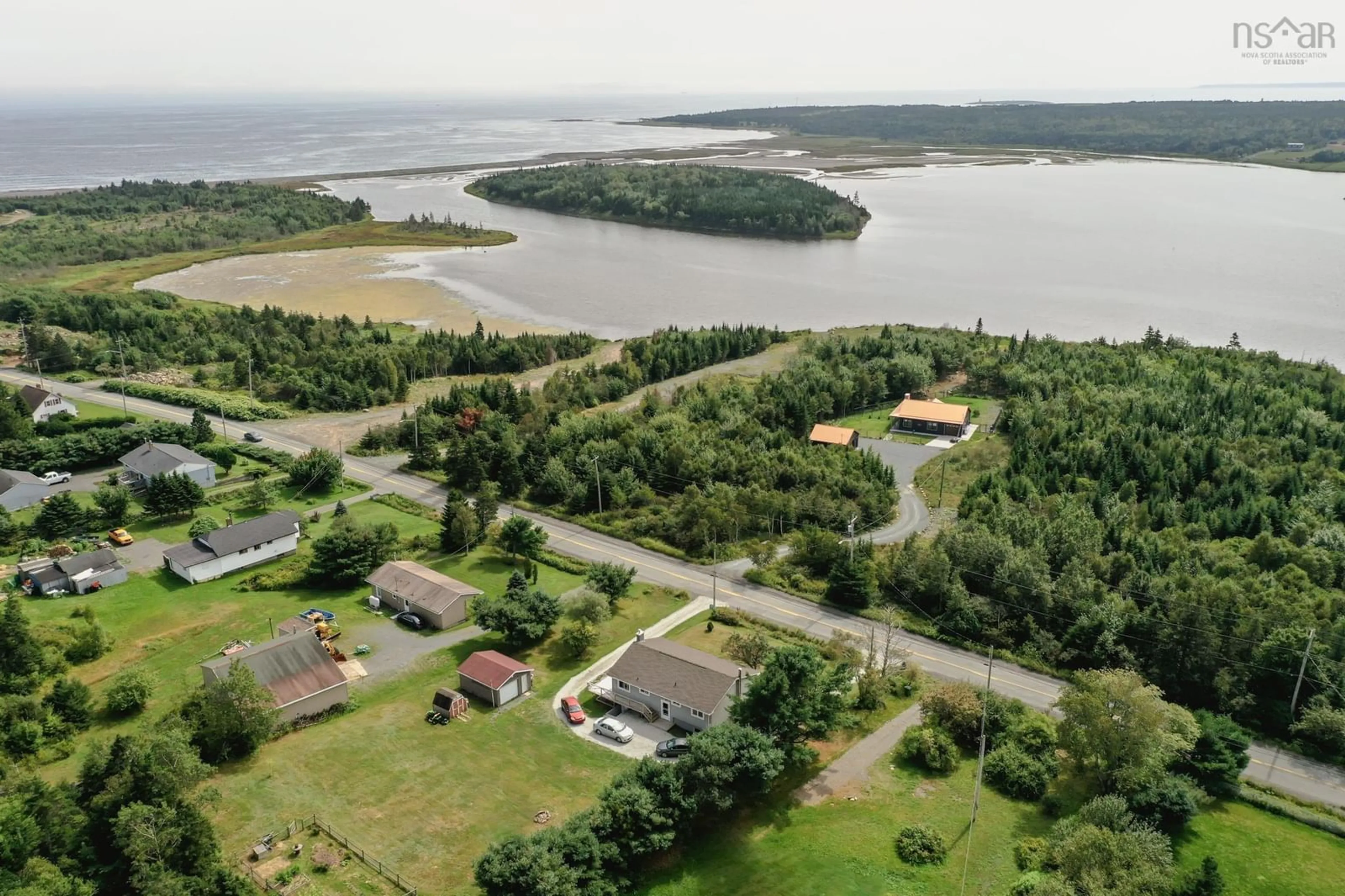 A pic from outside/outdoor area/front of a property/back of a property/a pic from drone, water/lake/river/ocean view for 1070 Cow Bay Rd, Cow Bay Nova Scotia B3G 1L5