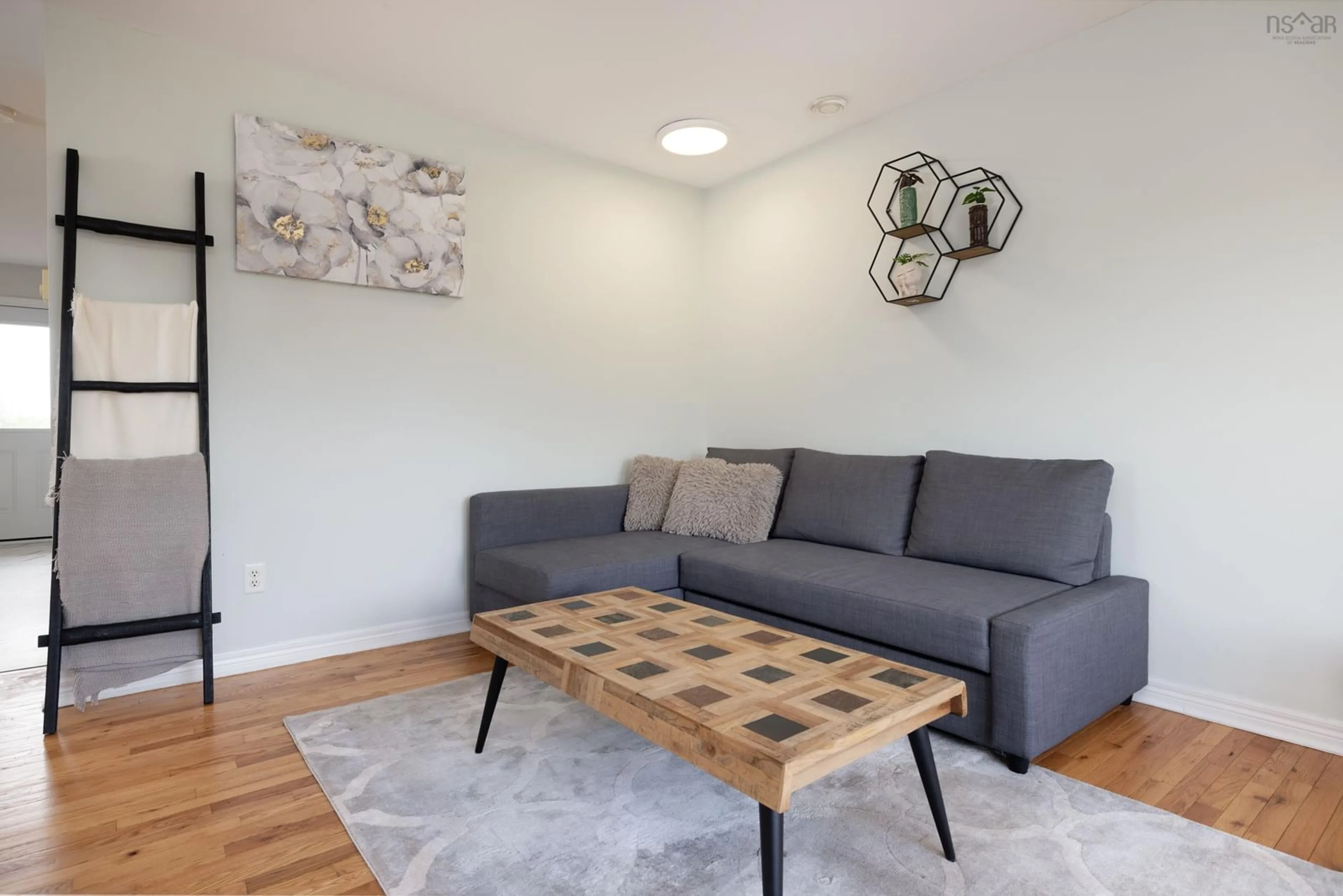 Living room with furniture, wood/laminate floor for 21 Peter Court, Eastern Passage Nova Scotia B3G 1S9