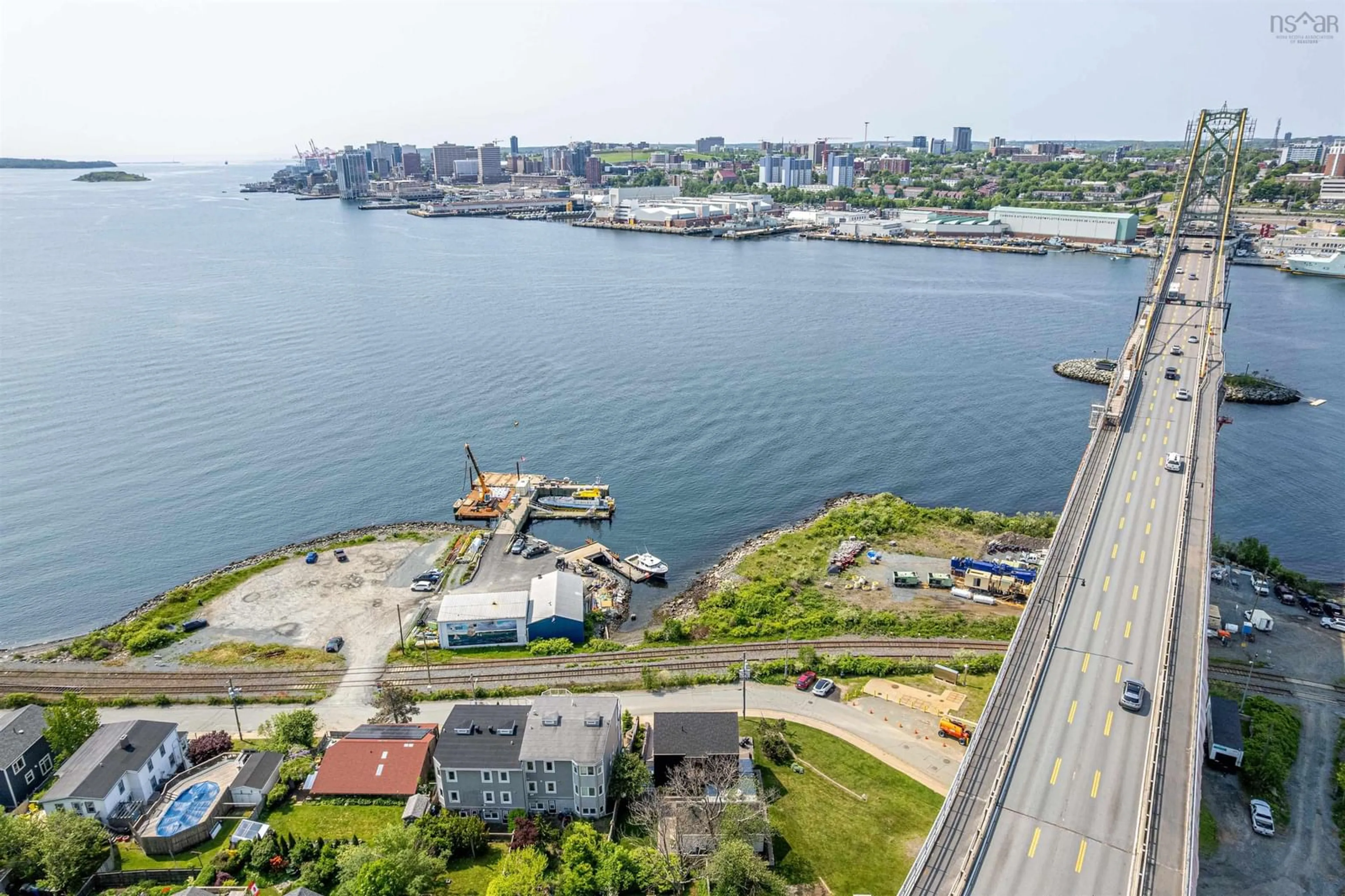 A pic from outside/outdoor area/front of a property/back of a property/a pic from drone, water/lake/river/ocean view for 90 Shore Rd, Dartmouth Nova Scotia B4A 1A4