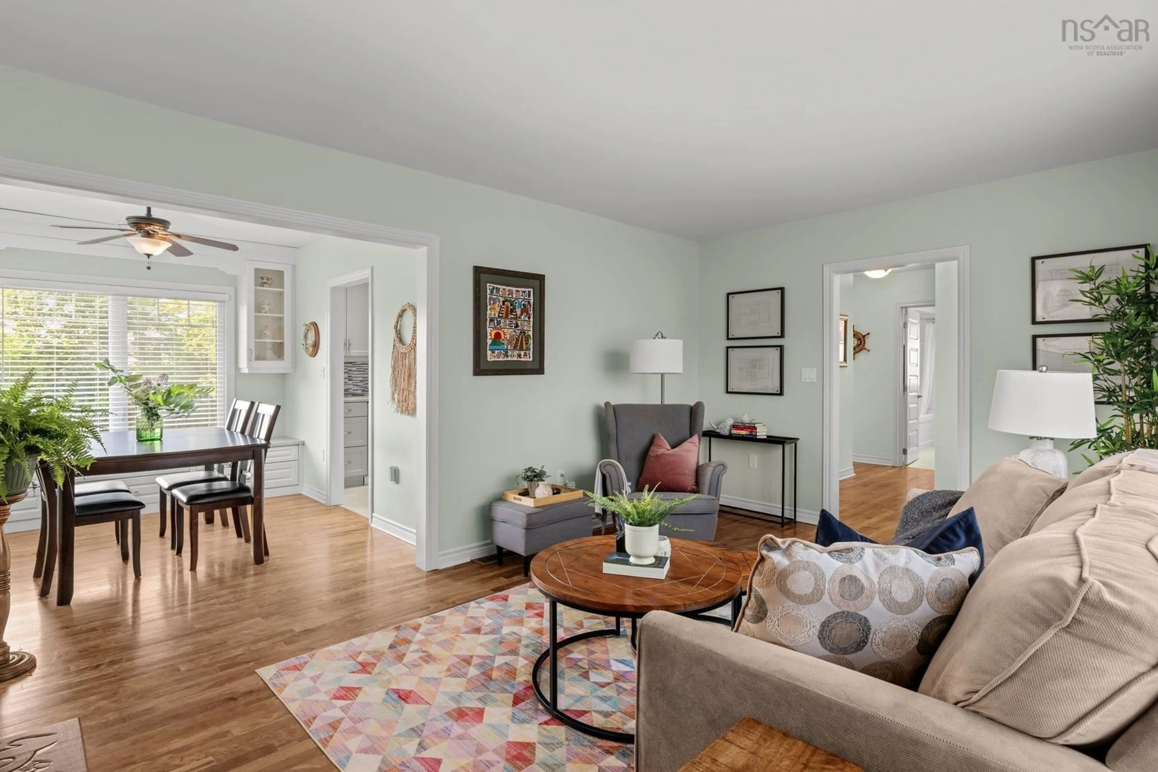 Living room with furniture, wood/laminate floor for 210 Main St, Dartmouth Nova Scotia B2X 1S5