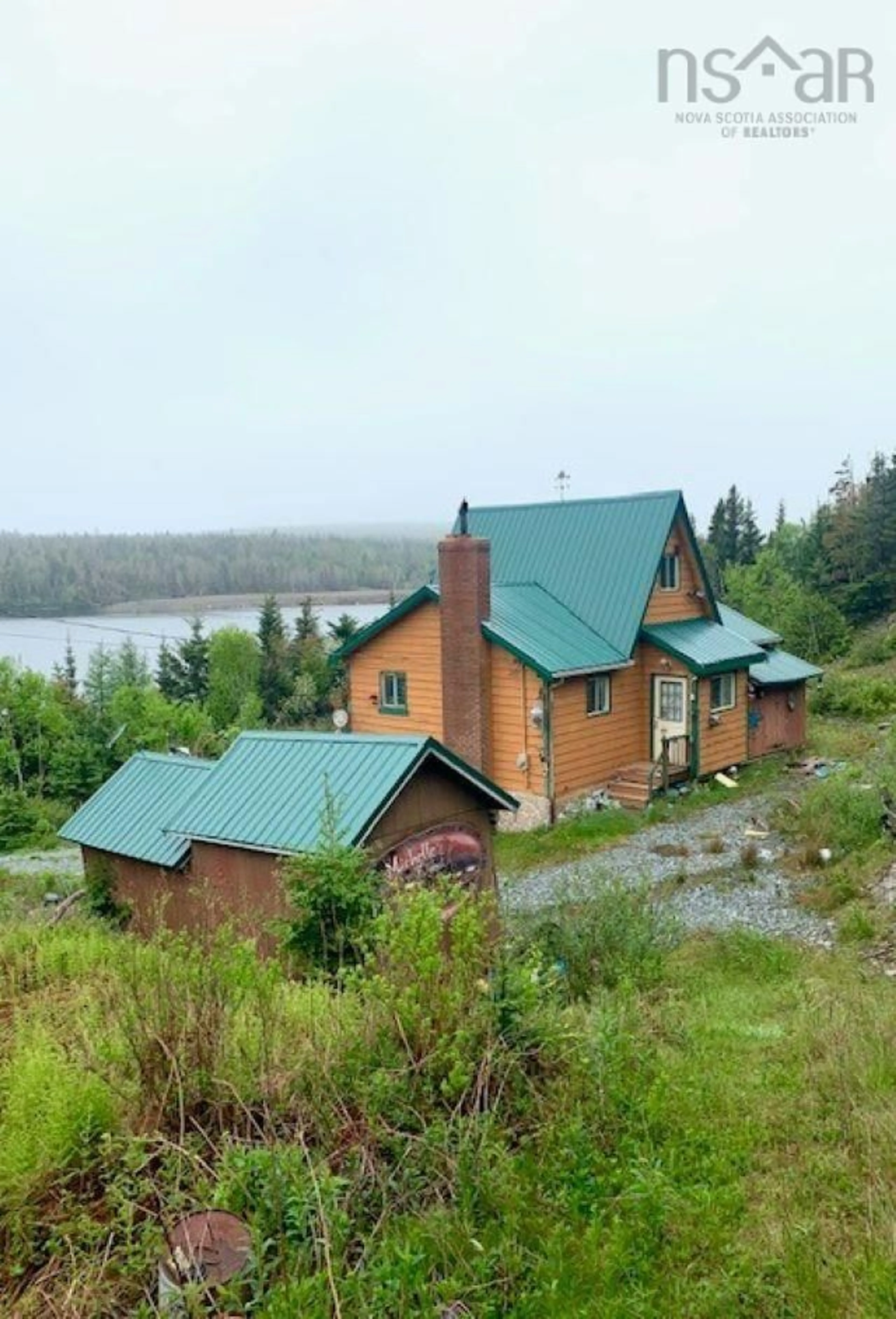 A pic from outside/outdoor area/front of a property/back of a property/a pic from drone, water/lake/river/ocean view for 115 Church Point Rd, Sheet Harbour Nova Scotia B0J 3B0