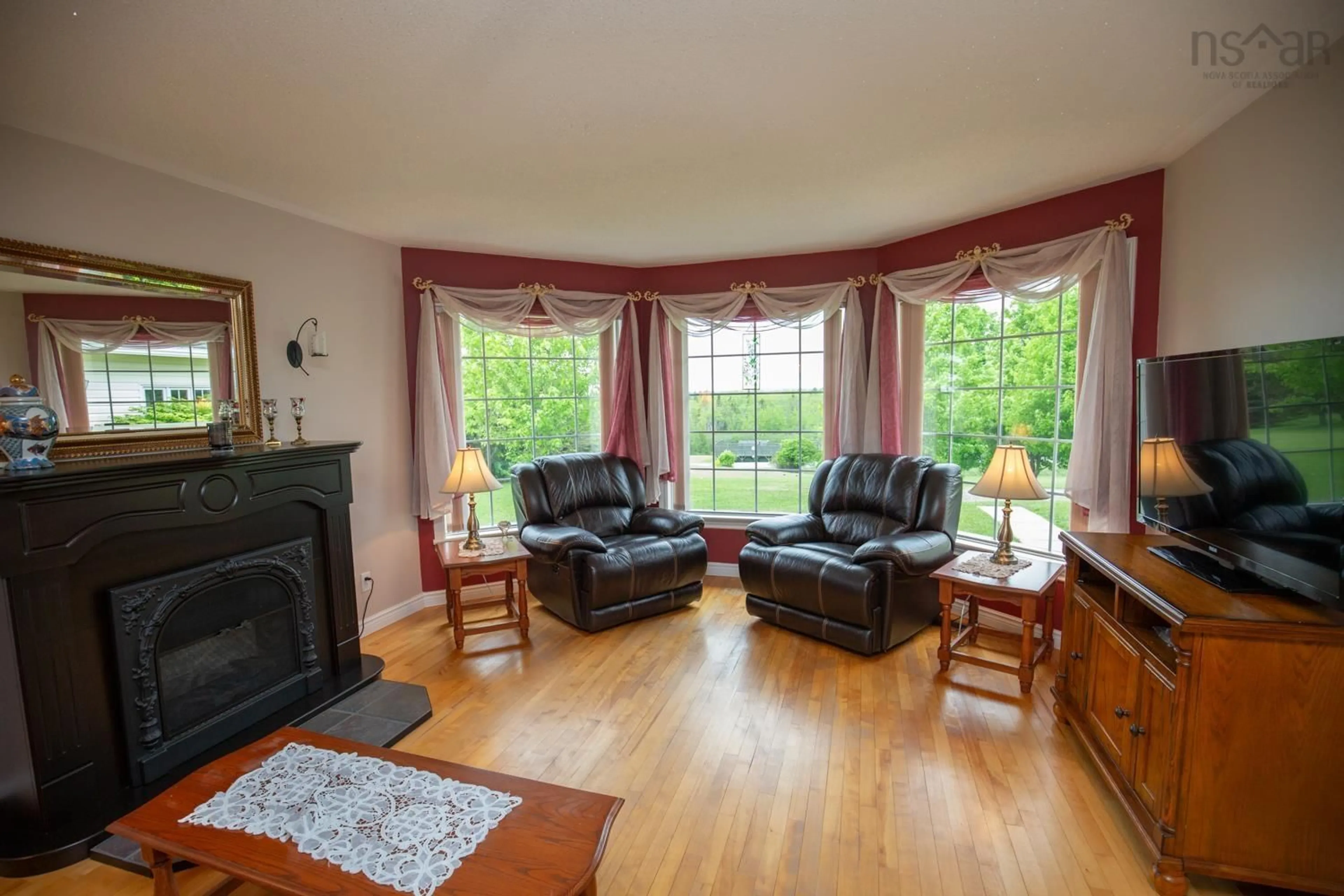 Living room with furniture, wood/laminate floor for 1332 Meadowvale Rd, Meadowvale Nova Scotia B0N 2P0