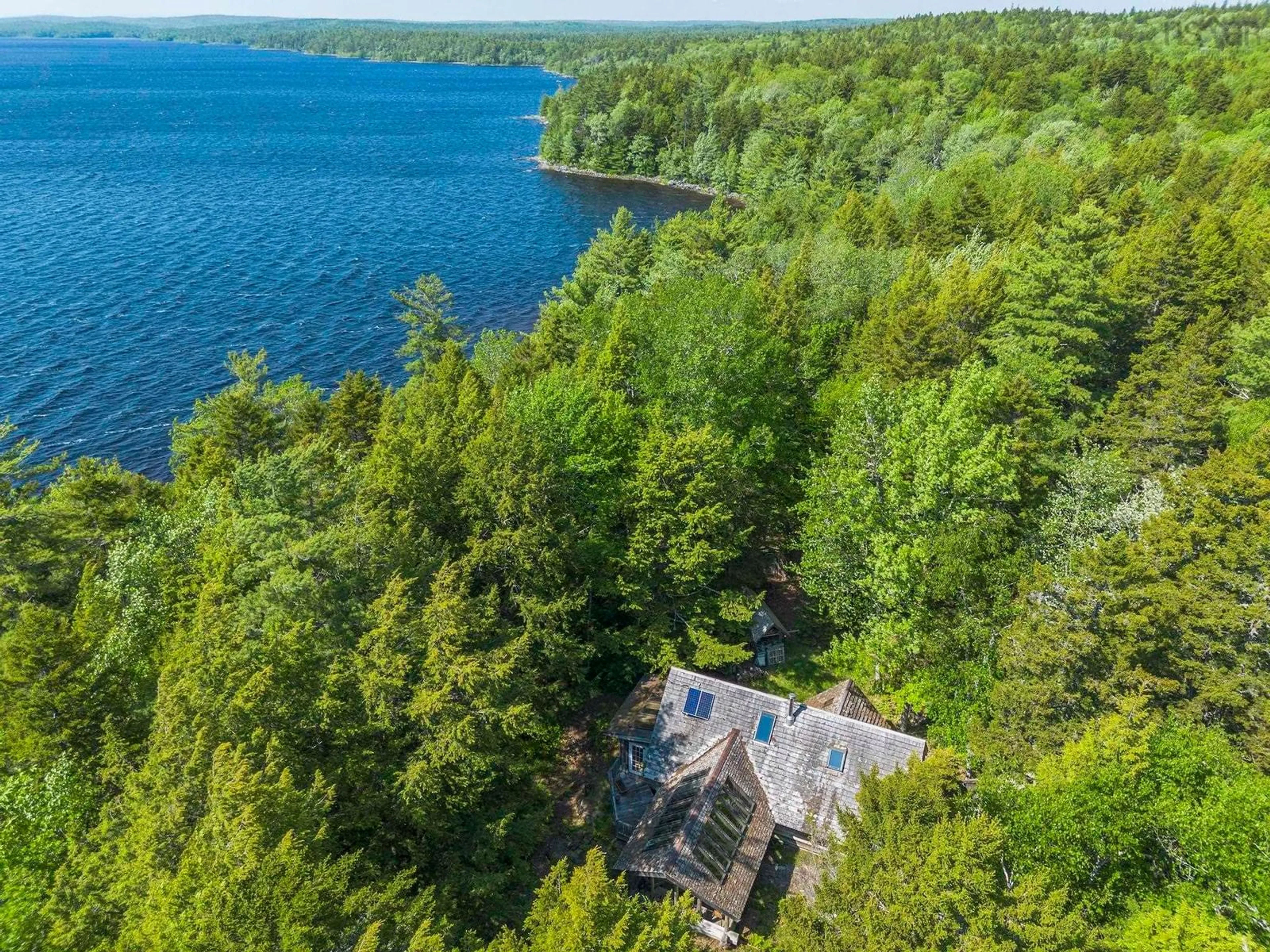 A pic from outside/outdoor area/front of a property/back of a property/a pic from drone, water/lake/river/ocean view for 10 South Point Rd, Sherbrooke Lake Nova Scotia B0J 2M0