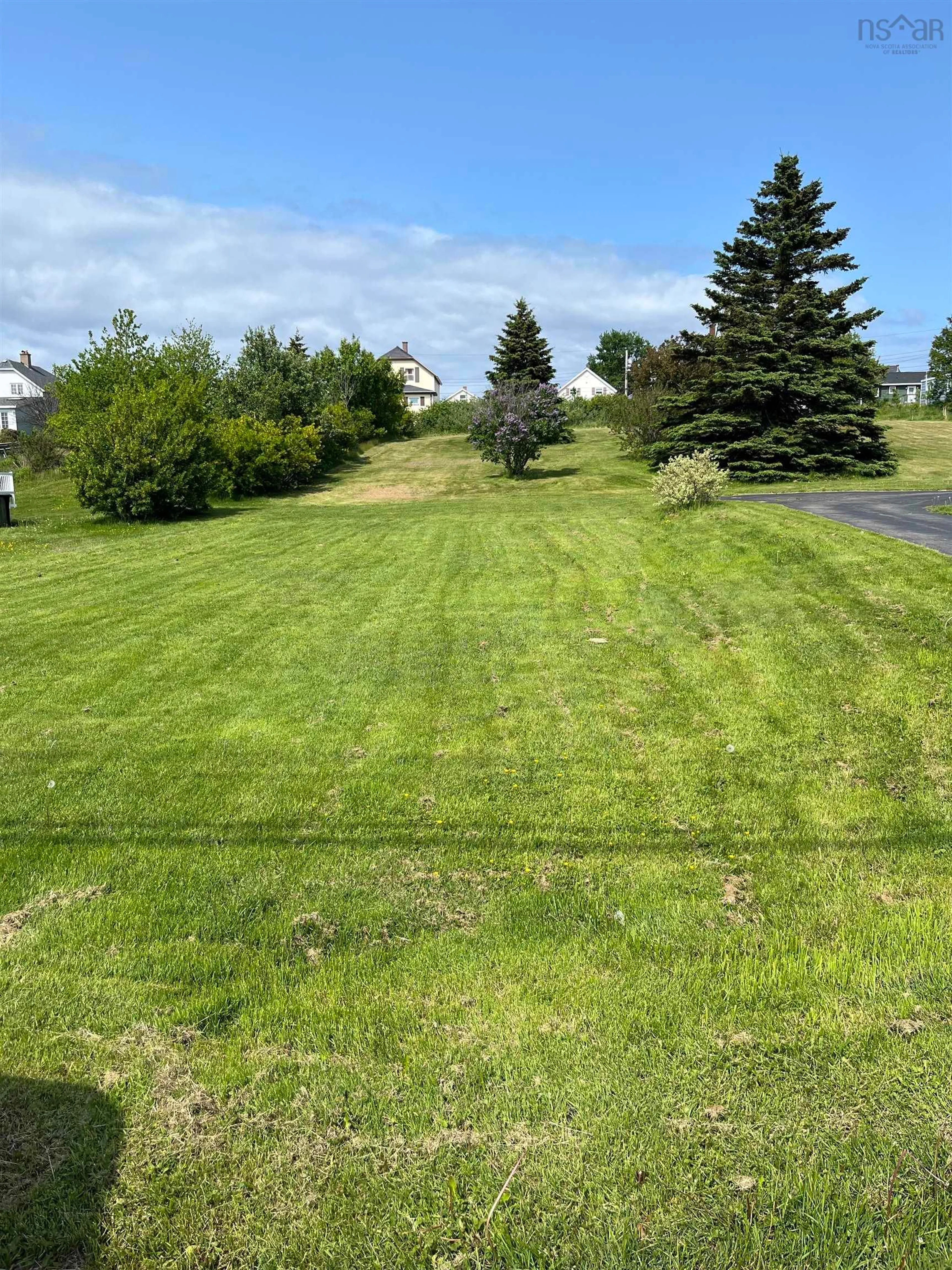A pic from outside/outdoor area/front of a property/back of a property/a pic from drone, water/lake/river/ocean view for 153 Lake Rd, Glace Bay Nova Scotia B1A 2G8