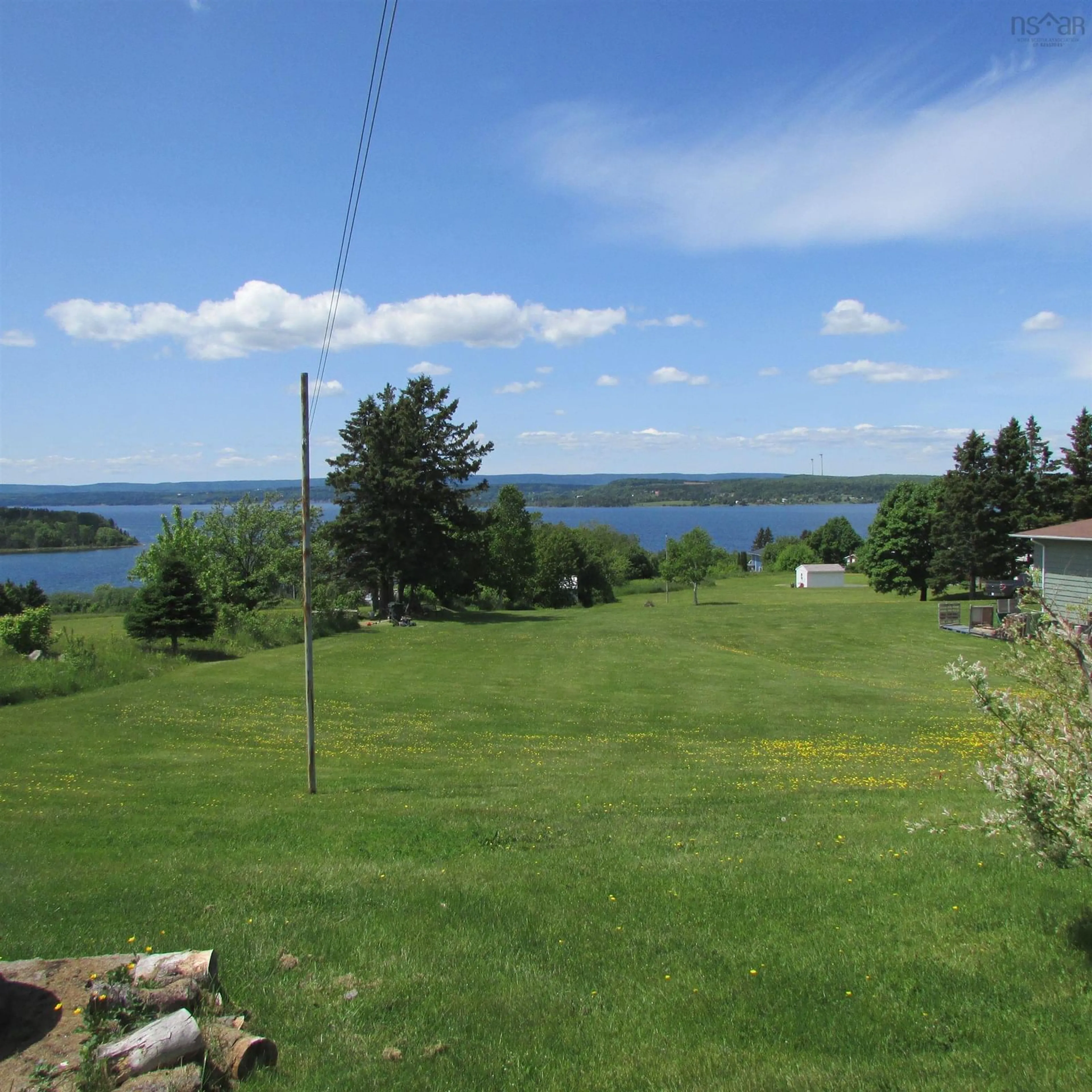 A pic from outside/outdoor area/front of a property/back of a property/a pic from drone, water/lake/river/ocean view for 25 Evelyns Ave, Georges River Nova Scotia B1Y 3G7
