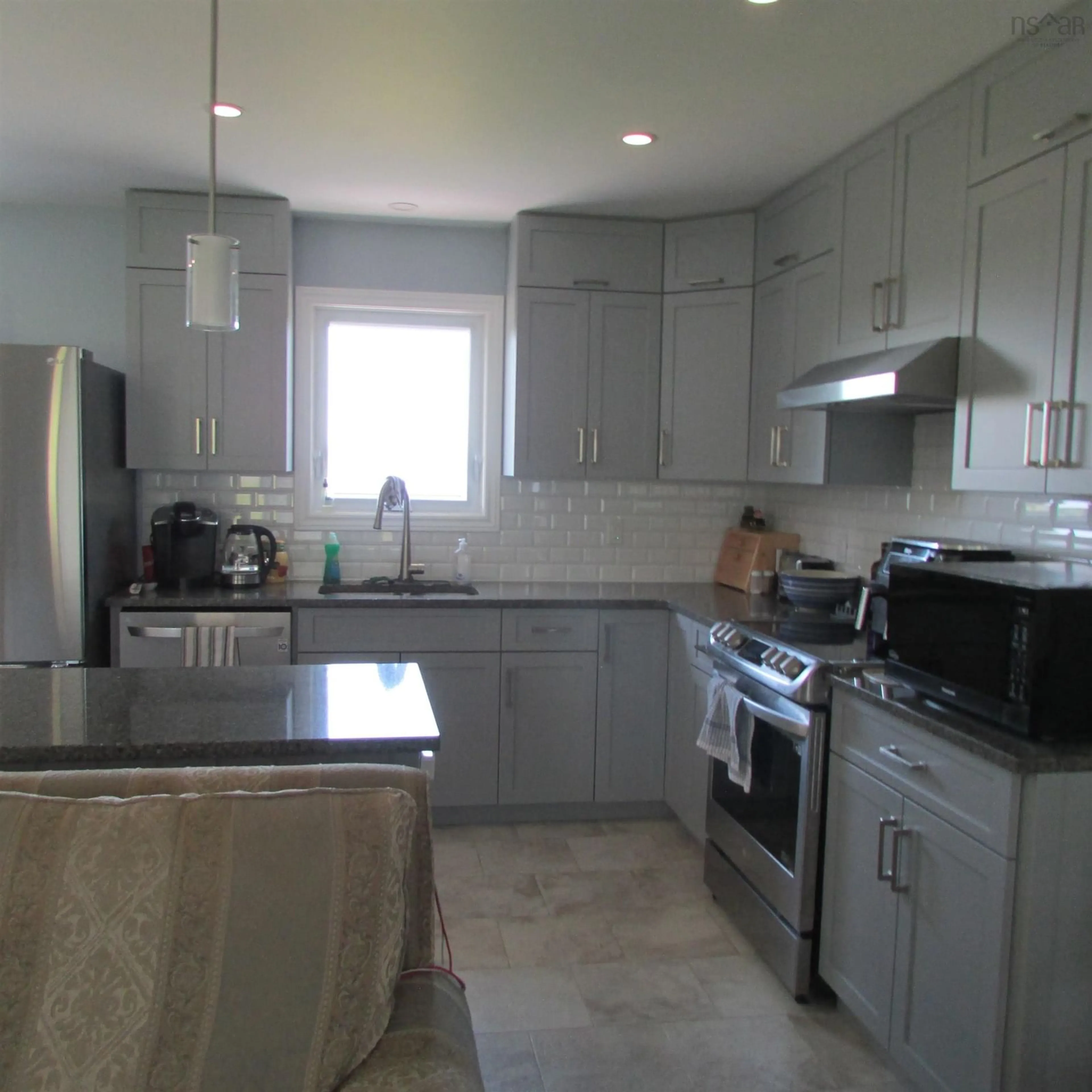 Open concept kitchen, ceramic/tile floor for 25 Evelyns Ave, Georges River Nova Scotia B1Y 3G7