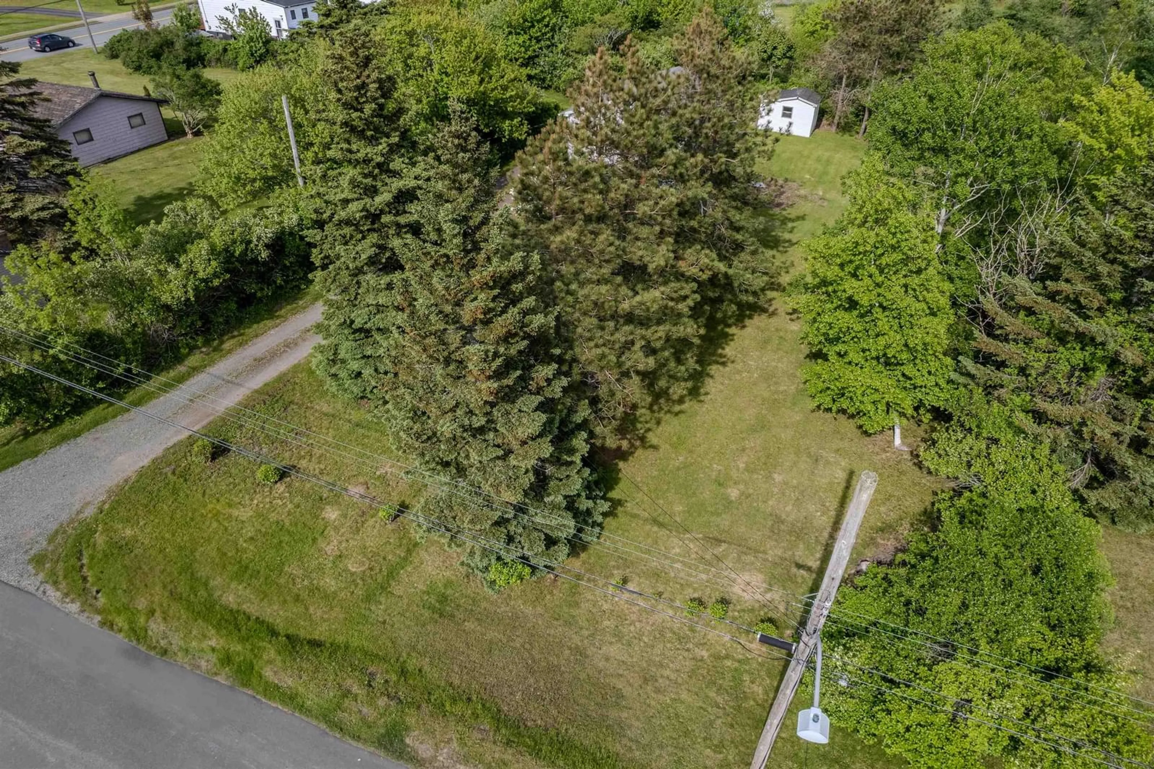 A pic from outside/outdoor area/front of a property/back of a property/a pic from drone, forest/trees view for 3 Mckinlay St, Glace Bay Nova Scotia B1A 2Y7