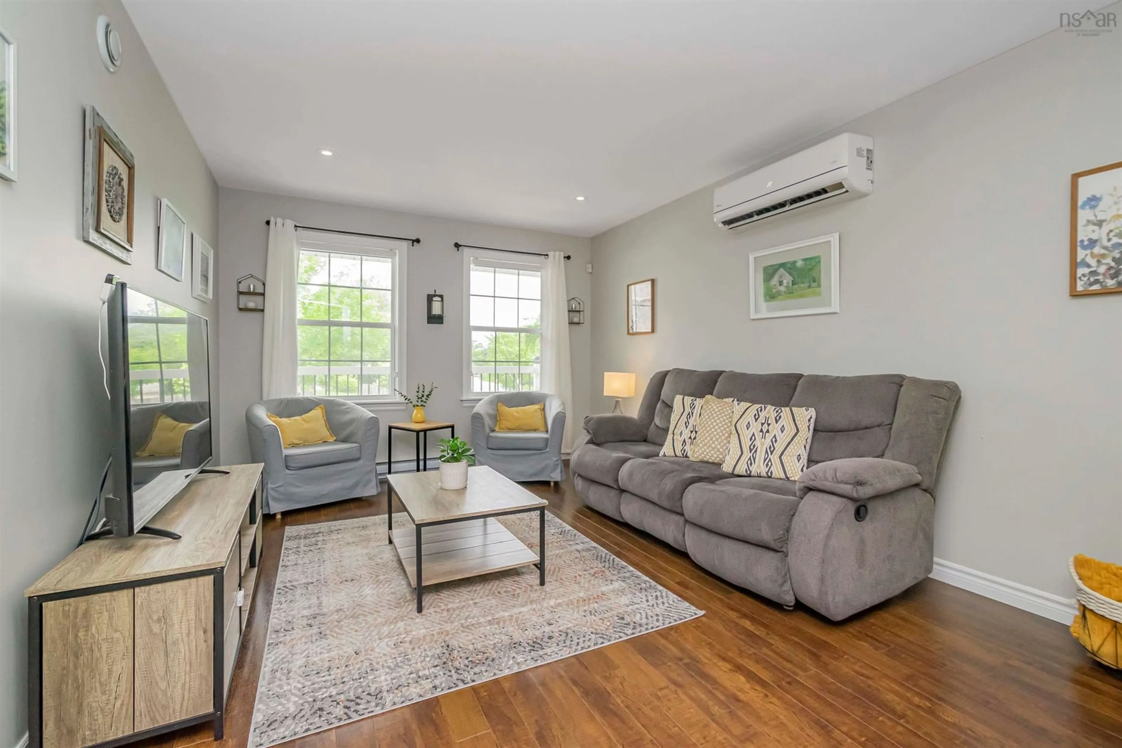 Living room with furniture, wood/laminate floor for 28 Inspector Crt, Spryfield Nova Scotia B3R 0A7
