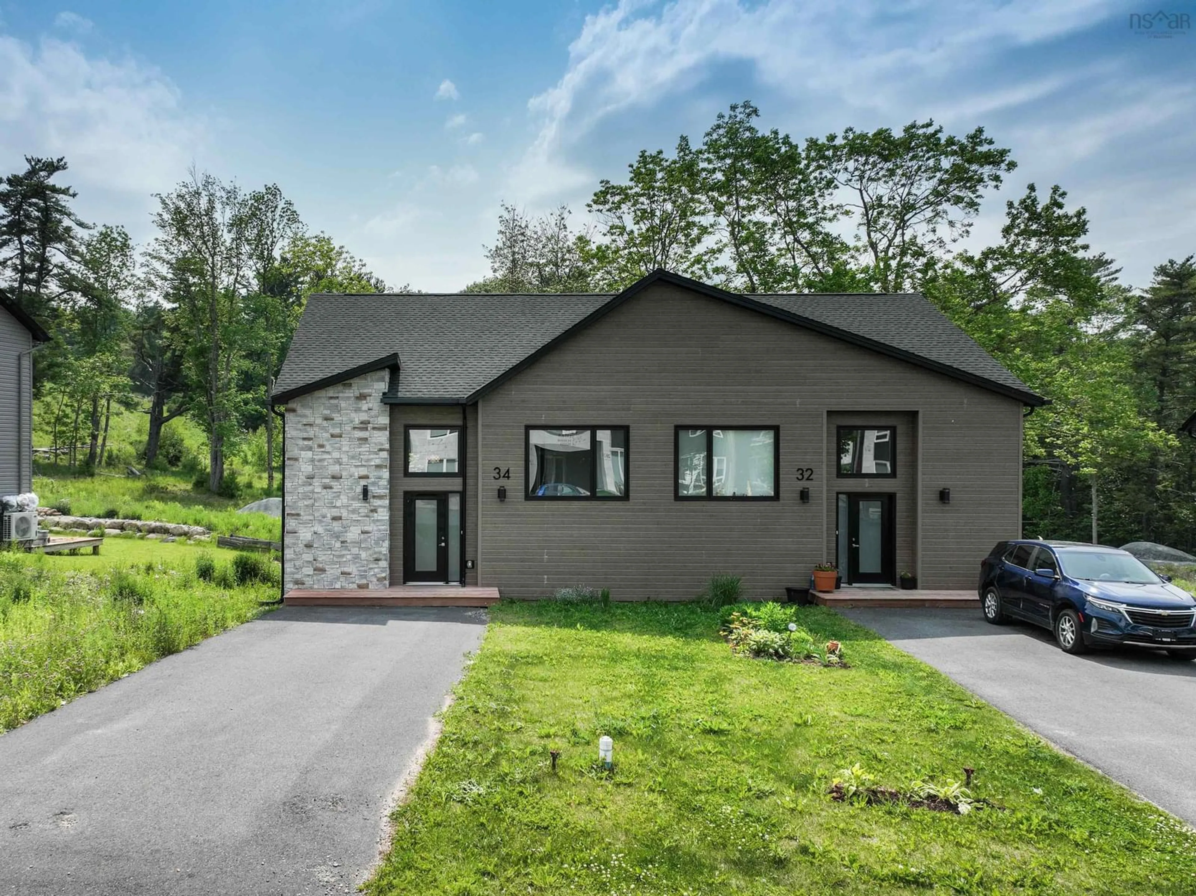 A pic from outside/outdoor area/front of a property/back of a property/a pic from drone, unknown for 34 Heckman Ave, Bridgewater Nova Scotia B4V 9G9