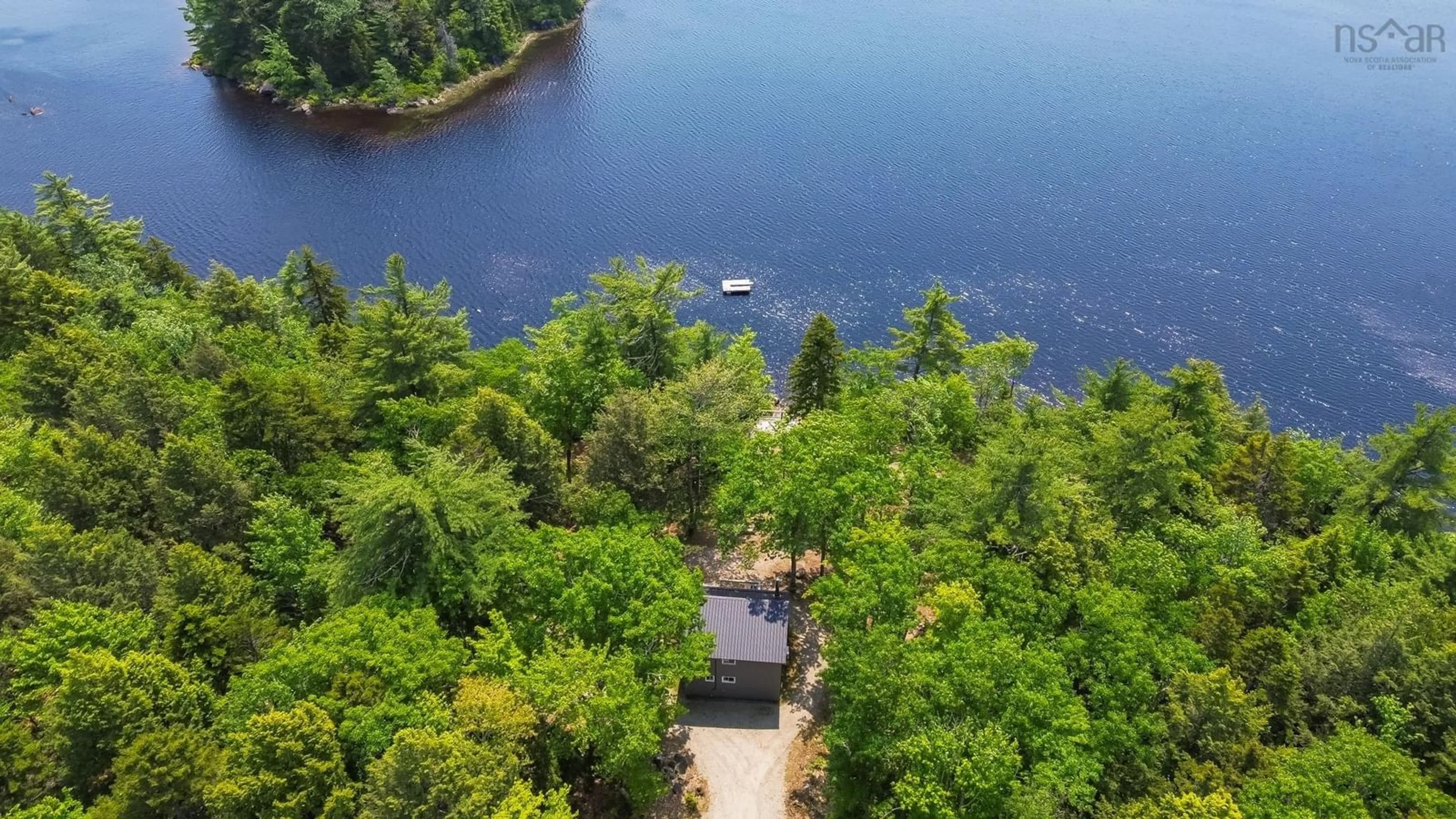 A pic from outside/outdoor area/front of a property/back of a property/a pic from drone, water/lake/river/ocean view for 404 Narrows Rd, Labelle Nova Scotia B0T 1E0