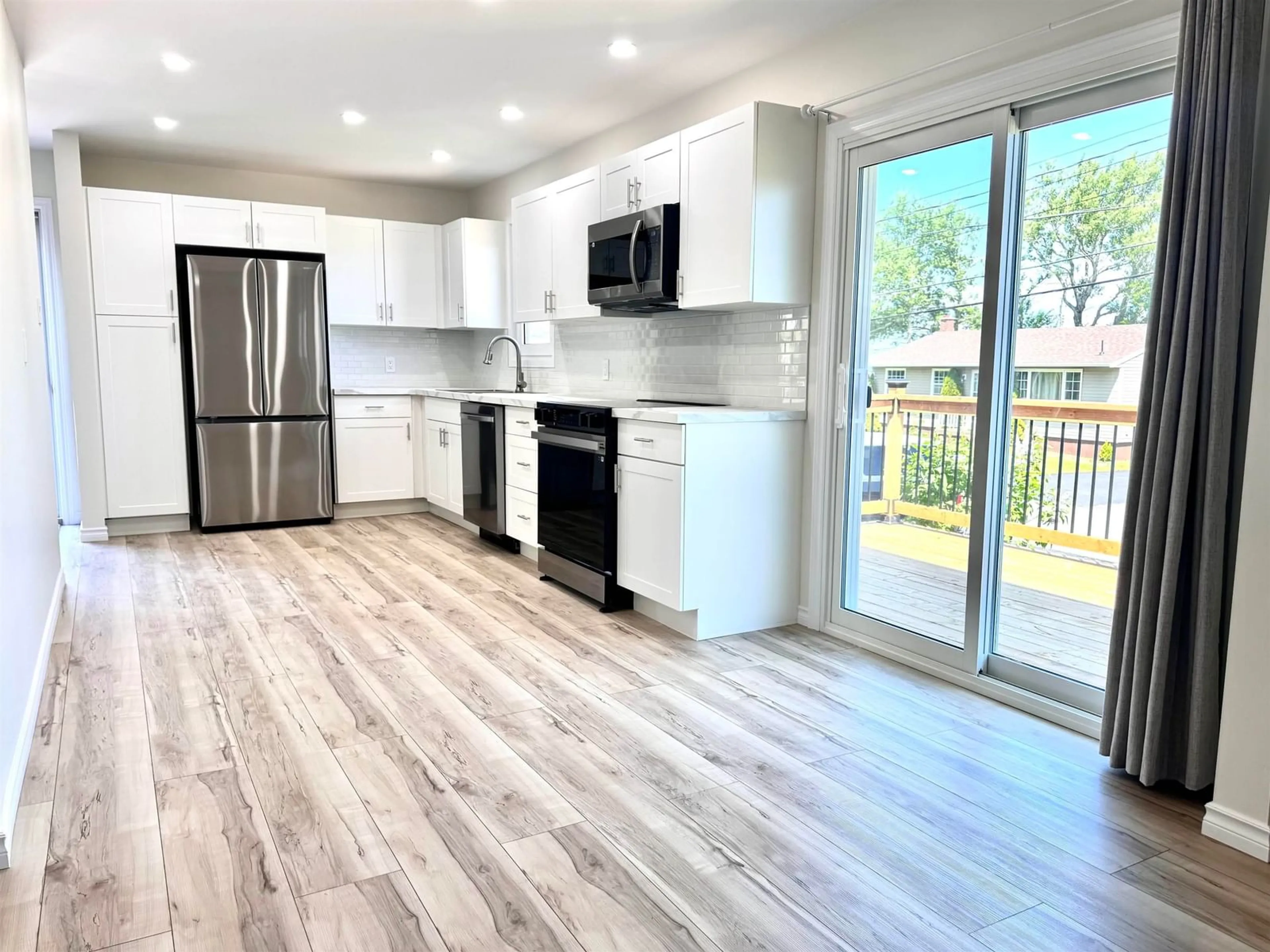 Open concept kitchen, wood/laminate floor for 10 Donovan Cres, Dominion Nova Scotia B1G 1C6