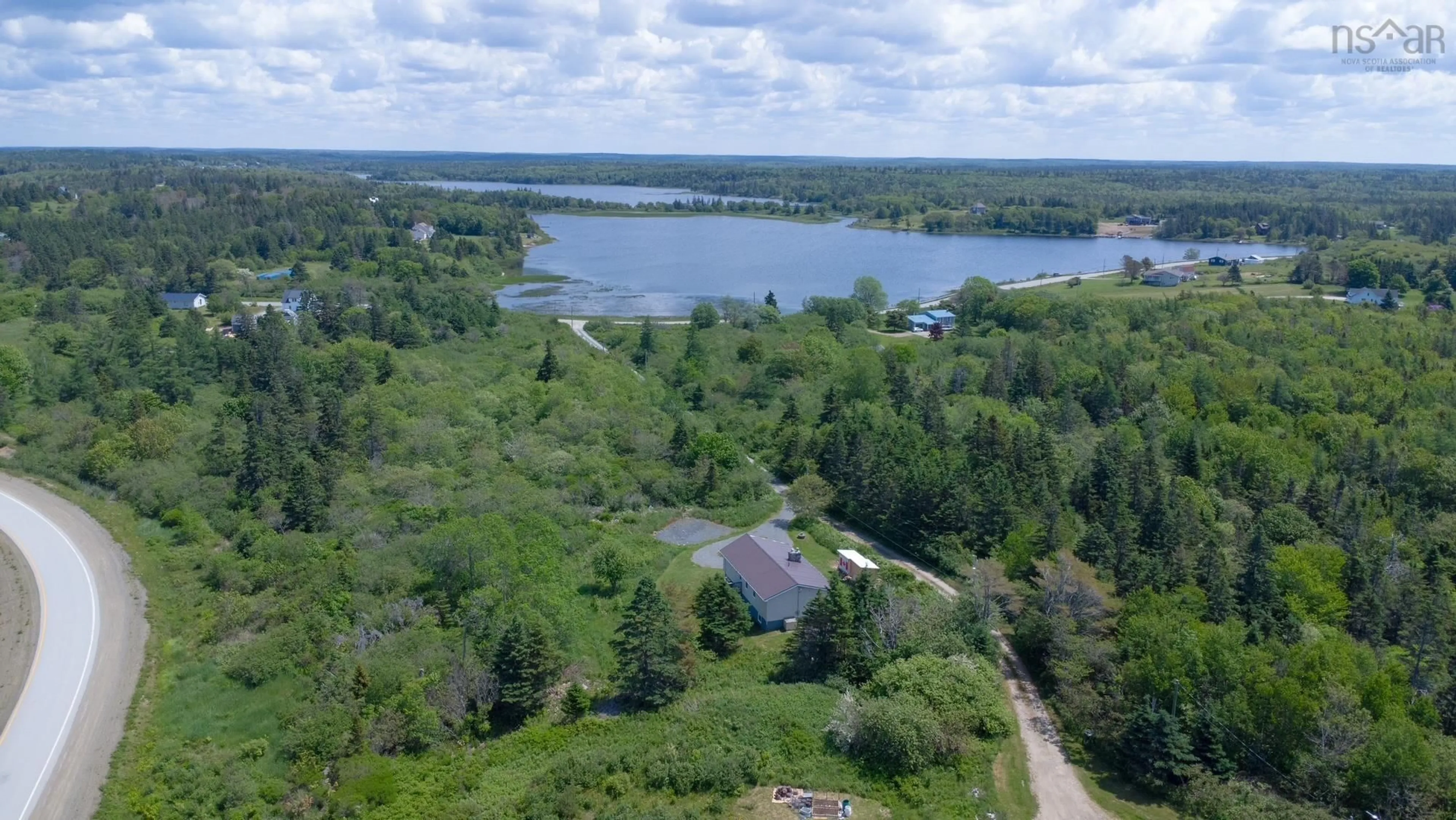 A pic from outside/outdoor area/front of a property/back of a property/a pic from drone, water/lake/river/ocean view for 62 Lake Doucette Rd, Lake Doucette Nova Scotia B0W 2Y0