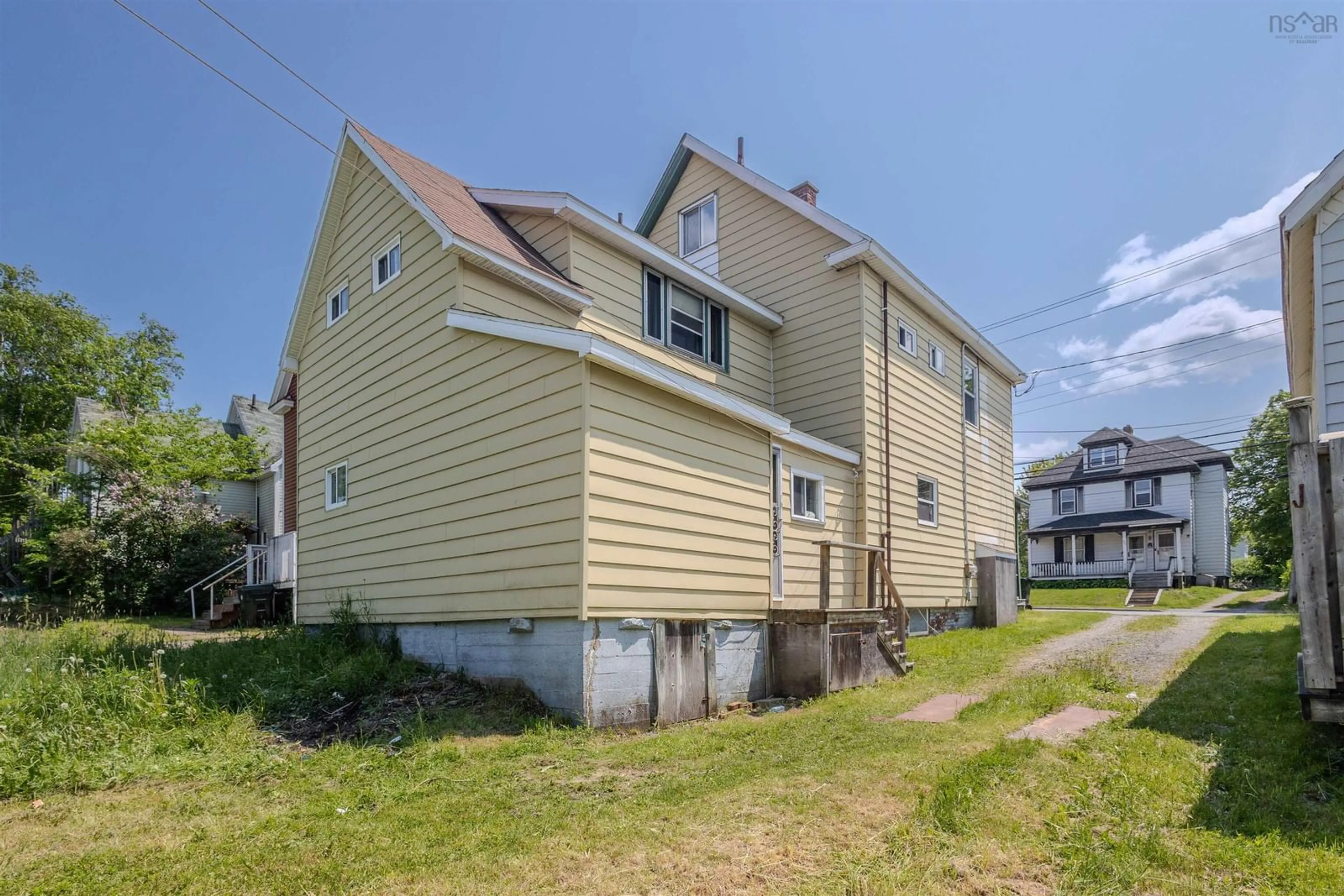 Home with vinyl exterior material, street for 391 Townsend St, Sydney Nova Scotia B1P 5G3